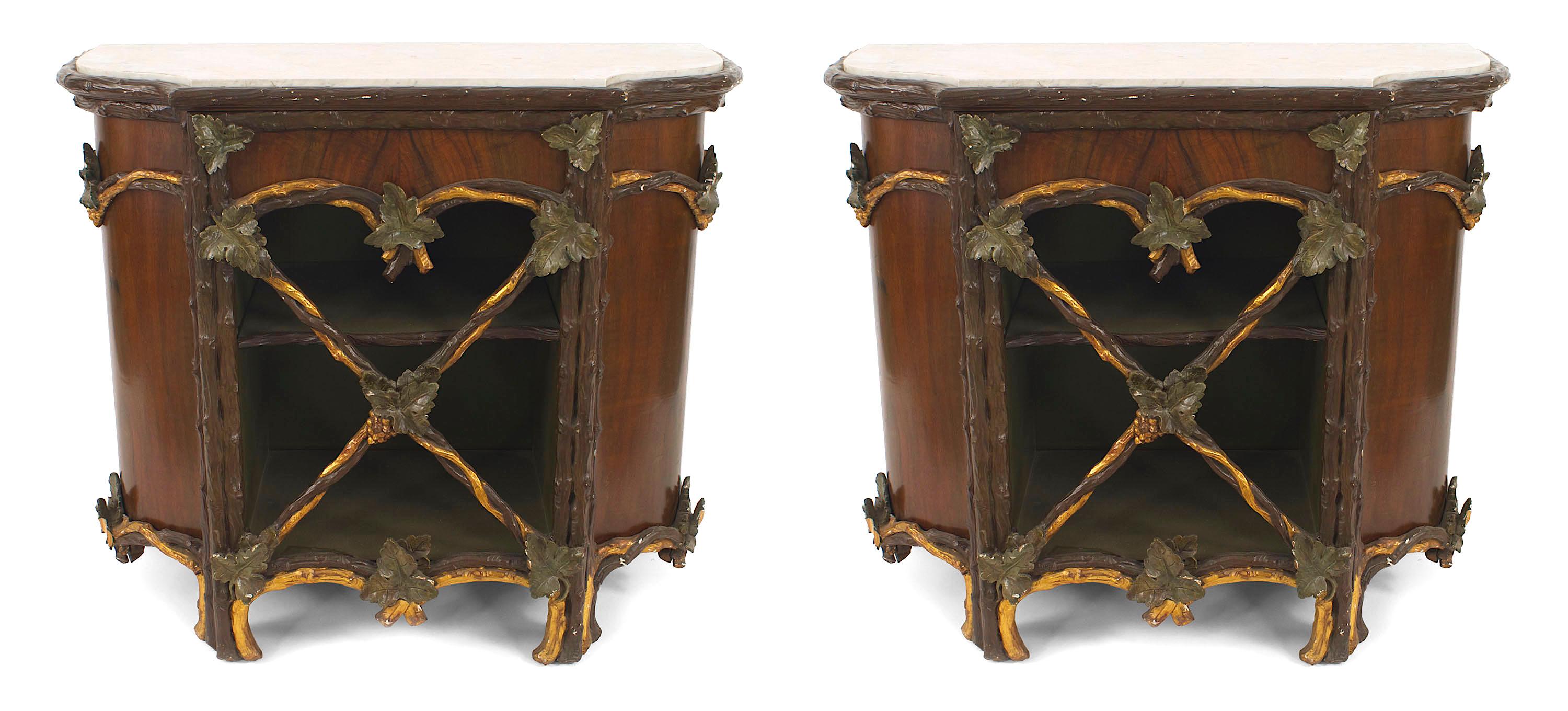 Pair of Rustic Continental (19th Century) painted and gilt trimmed commodes with carved leaf design on front door with shaped white marble top. (Related item: 056123) (PRICED AS Pair).
