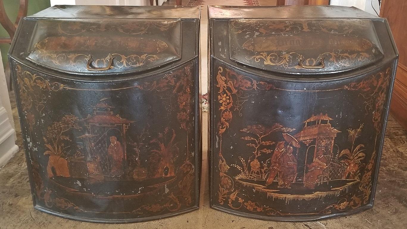 Presenting a gorgeous and extremely rare pair mid-19th century, metal tea bins, by Henry Troemner of Philadelphia, PA in the chinoiserie style.
From circa 1845.

Made of black enameled metal, probably tin, each tea tin/chest has a different oriental