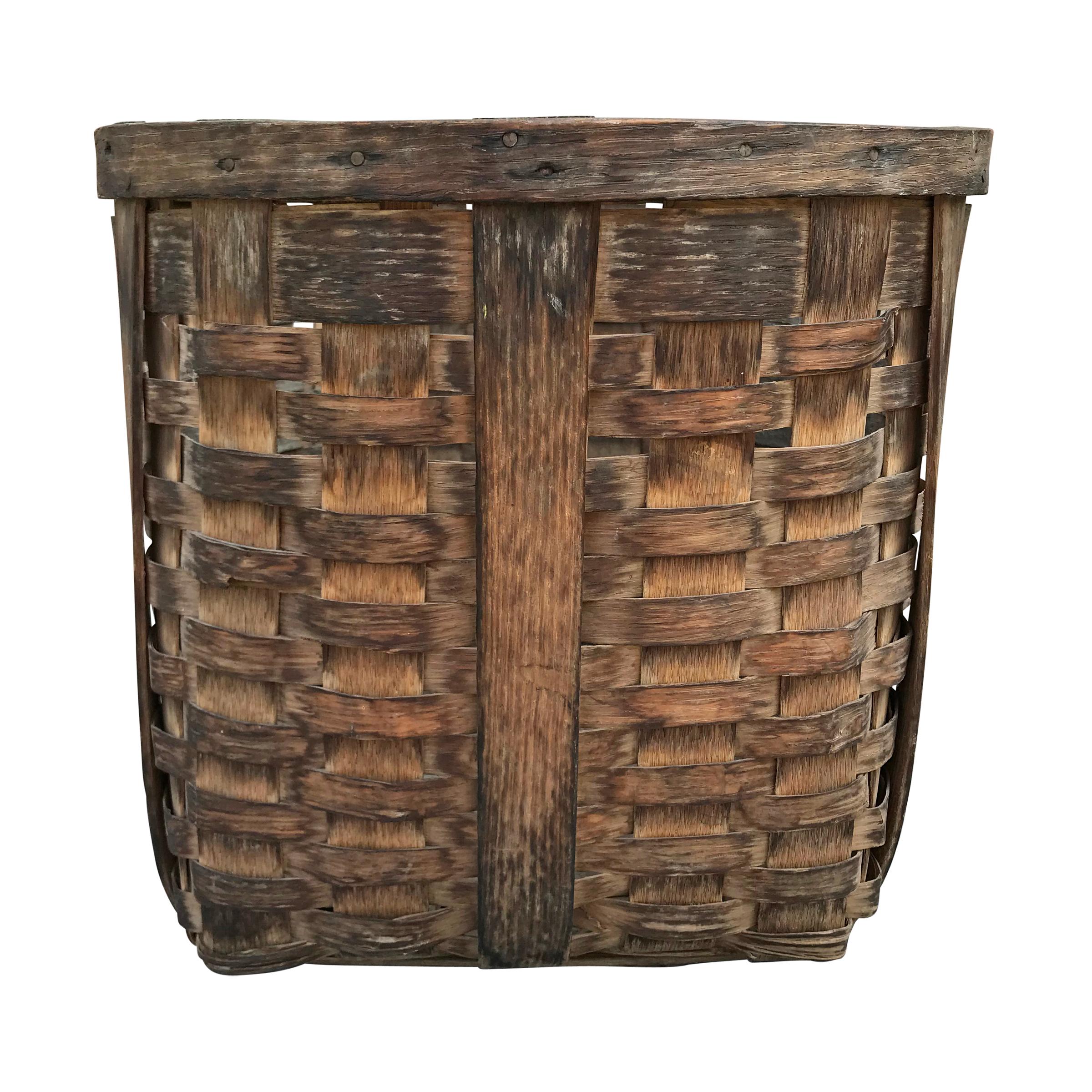 A lovely pair of 19th century American handwoven oak splint potato gathering baskets, found in Northern Michigan, with wonderful patina, each with two handles and wide straps sturdy enough to support the weight of a basket full of potatoes. The
