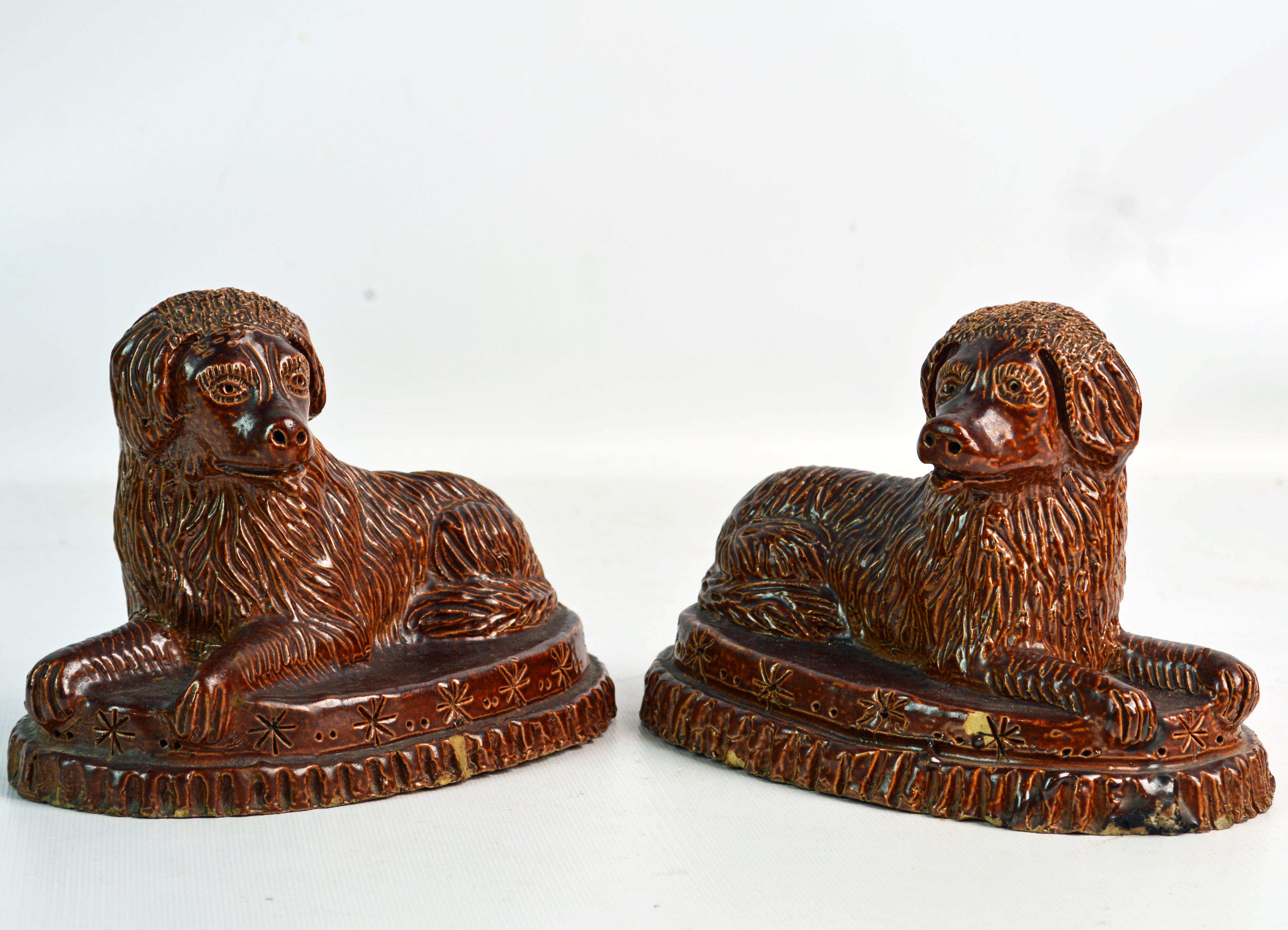 Folk Art Pair of 19th Century American Yellow Ware Recumbent Spaniels on Oval Plinths