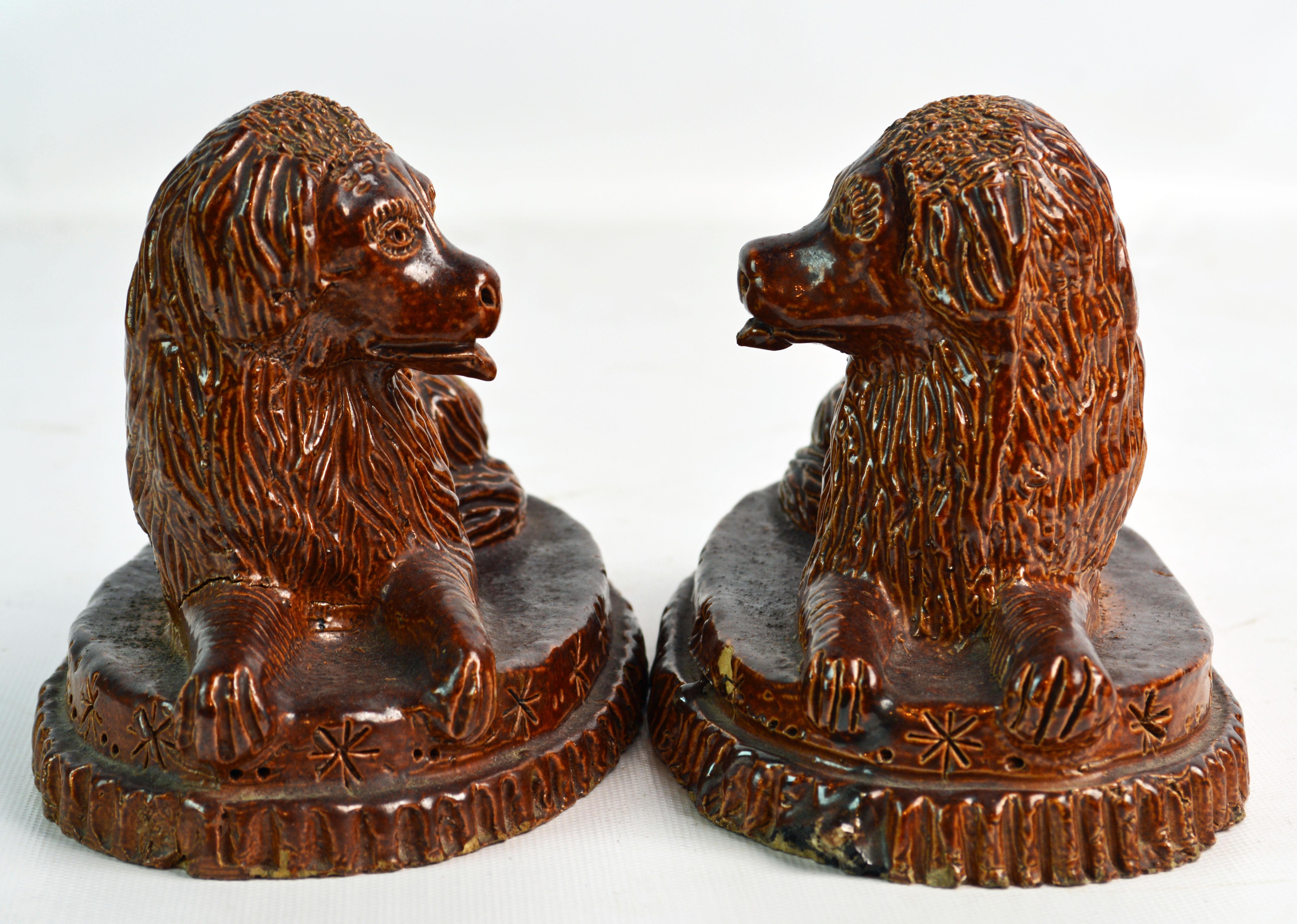 Pair of 19th Century American Yellow Ware Recumbent Spaniels on Oval Plinths In Good Condition In Ft. Lauderdale, FL