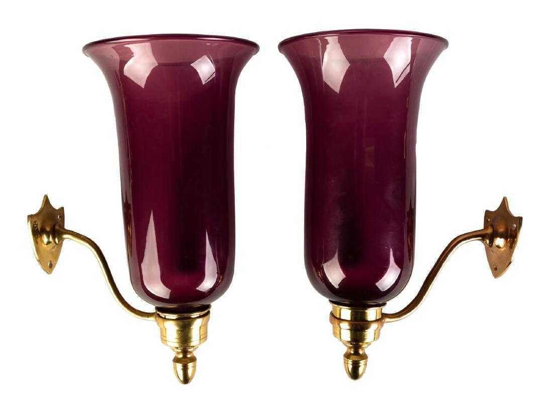 Pair of Anglo Grape glass hand blown wall sconces. brass Georgian shield back arm mounts. can be french wired for electricity at client's request.

Beautiful, rare color.