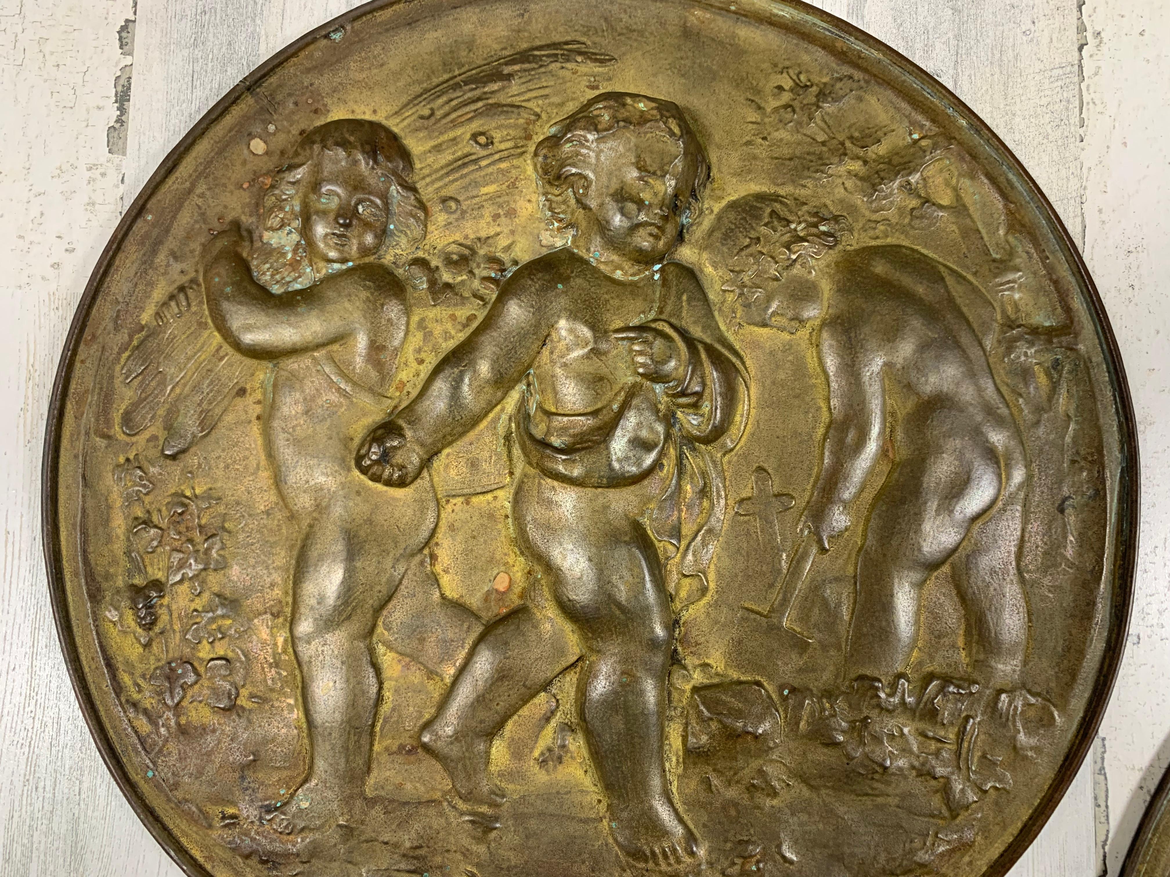 Pair of 19th Century Angels at Work Brass Repousse Decorative Rounds In Good Condition For Sale In Denton, TX