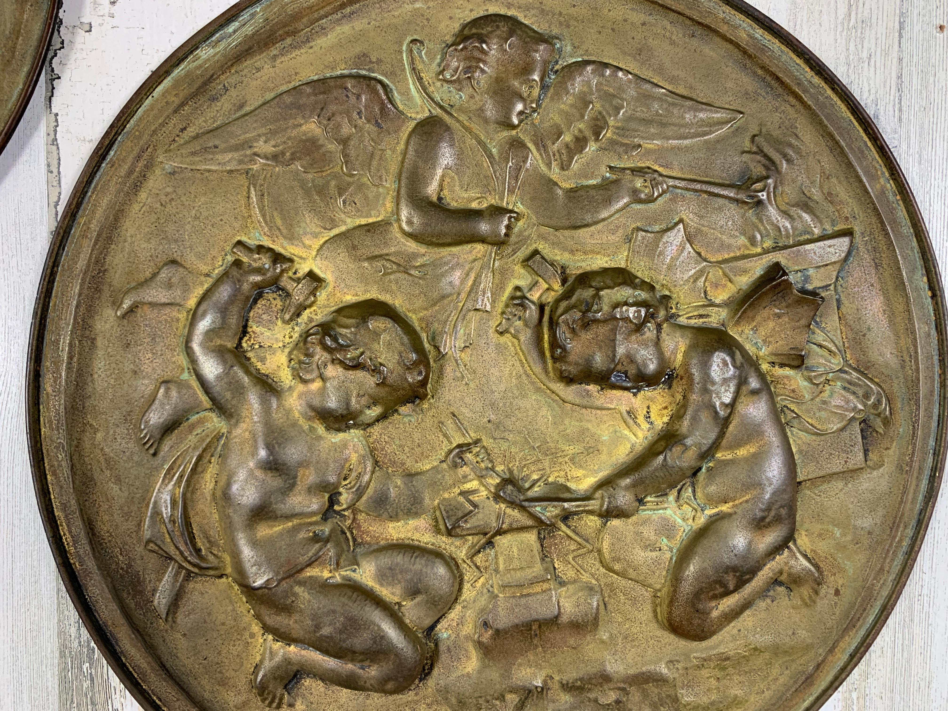 Pair of 19th Century Angels at Work Brass Repousse Decorative Rounds For Sale 1