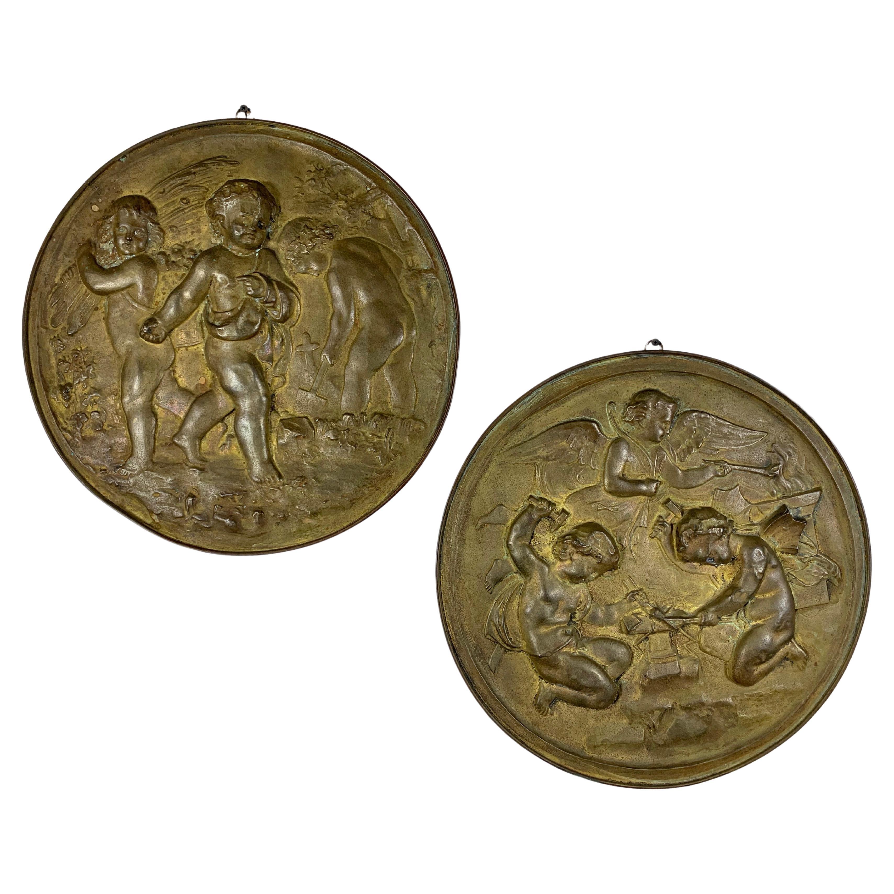 Pair of 19th Century Angels at Work Brass Repousse Decorative Rounds For Sale
