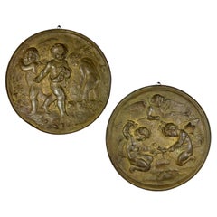 Pair of 19th Century Angels at Work Brass Repousse Decorative Rounds