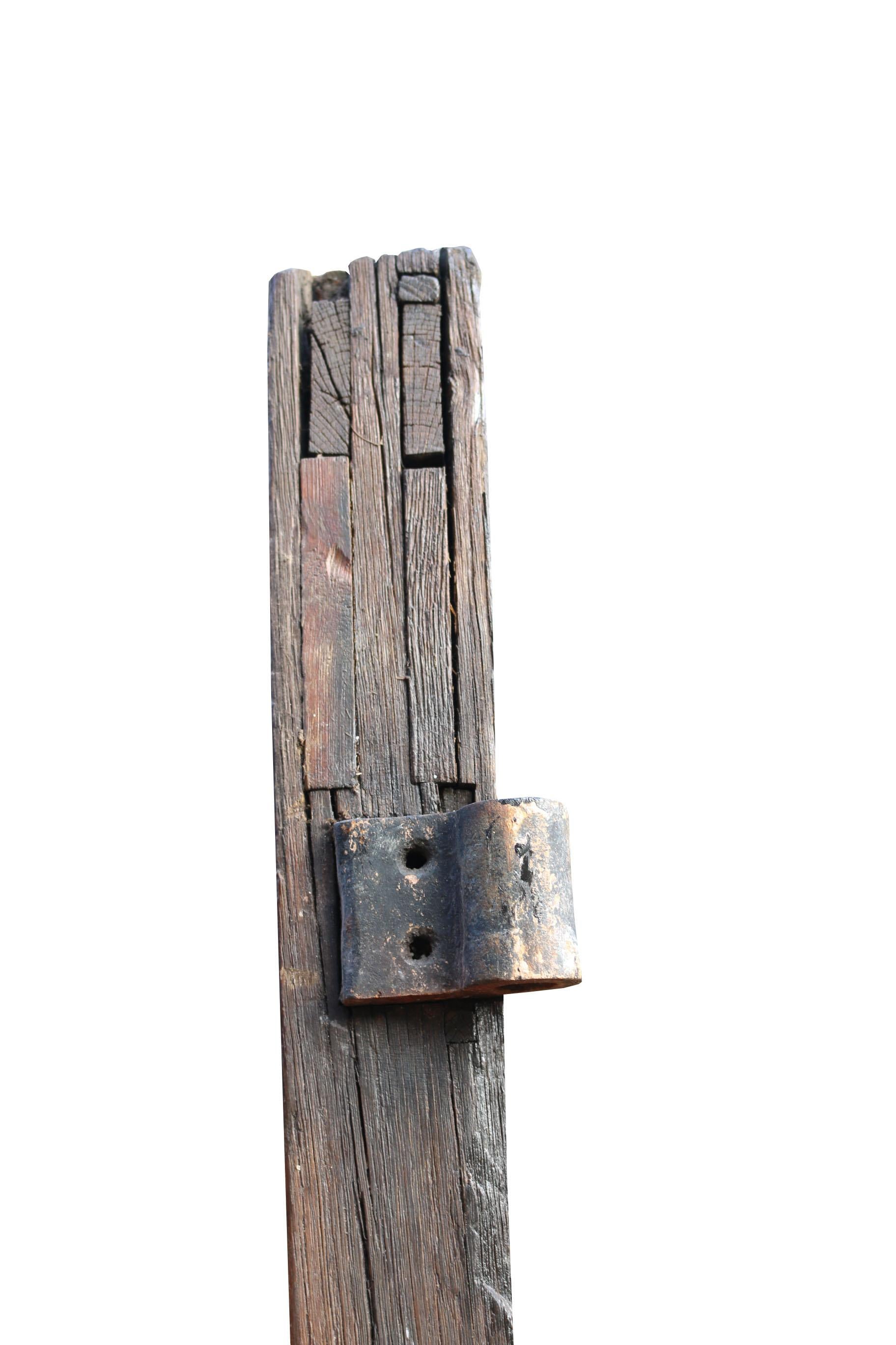 This door is solid oak and is in good condition for its age. There is a bend to one side and weathering to the base, which could be replaced. 

Measures: Height 221 cm

Width 134.5 cm (excluding hinges)

Depth 9 cm 

Weight 128 kg.