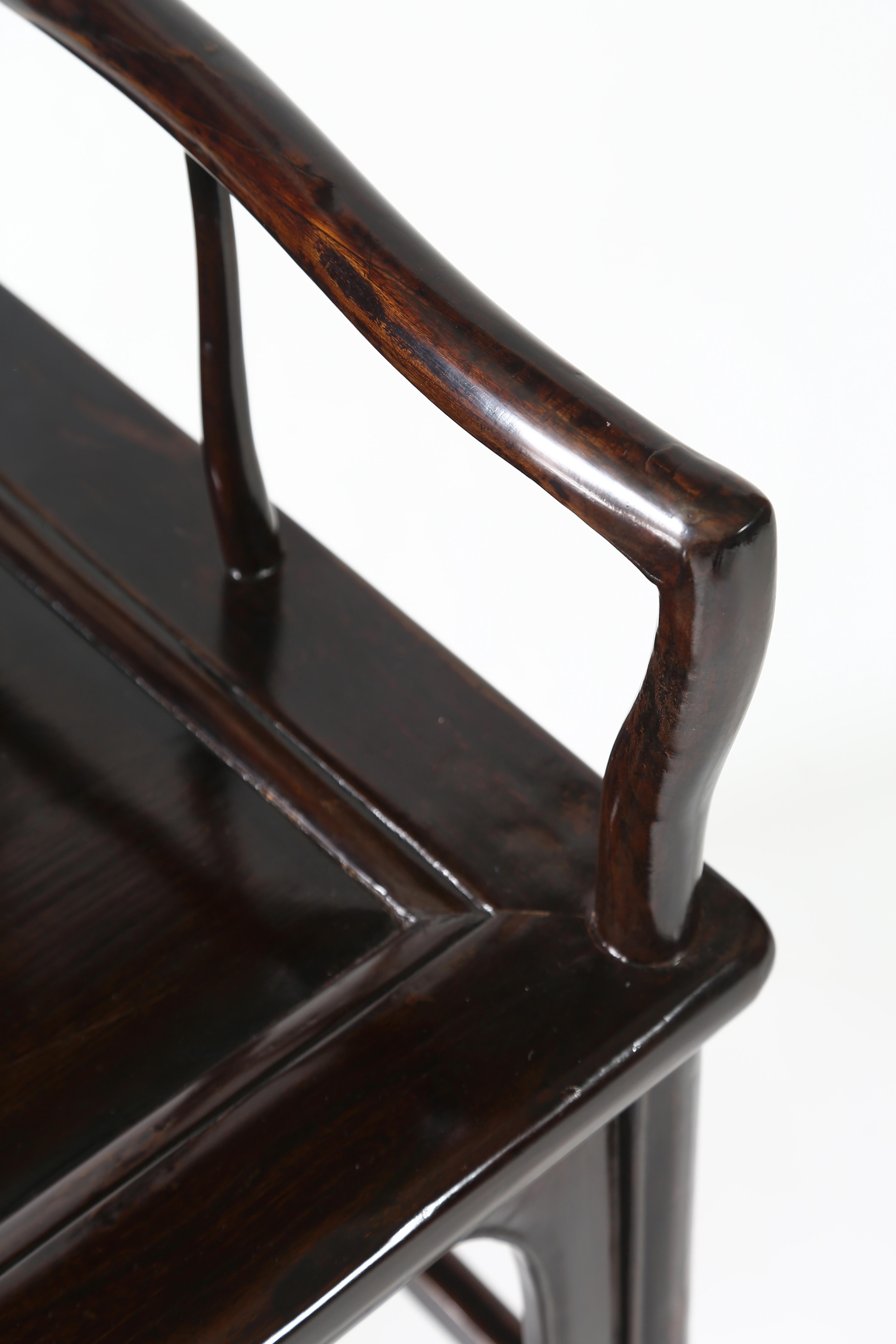Pair of southern official’s hat armchairs.

The humpback crest rail supported by the back posts curving slightly backward at the top and extending to form the back legs, the back splat in S-curve with relief-carved knotted key scrolls motif,