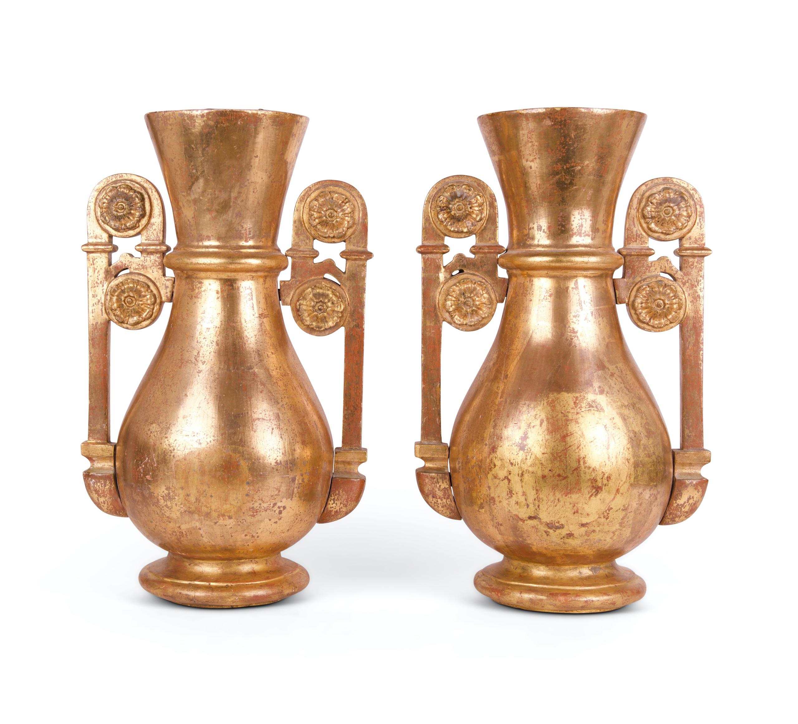 A superb pair of Baltic early 19th century giltwood neo-classical paterae mounted twin-handled vases.