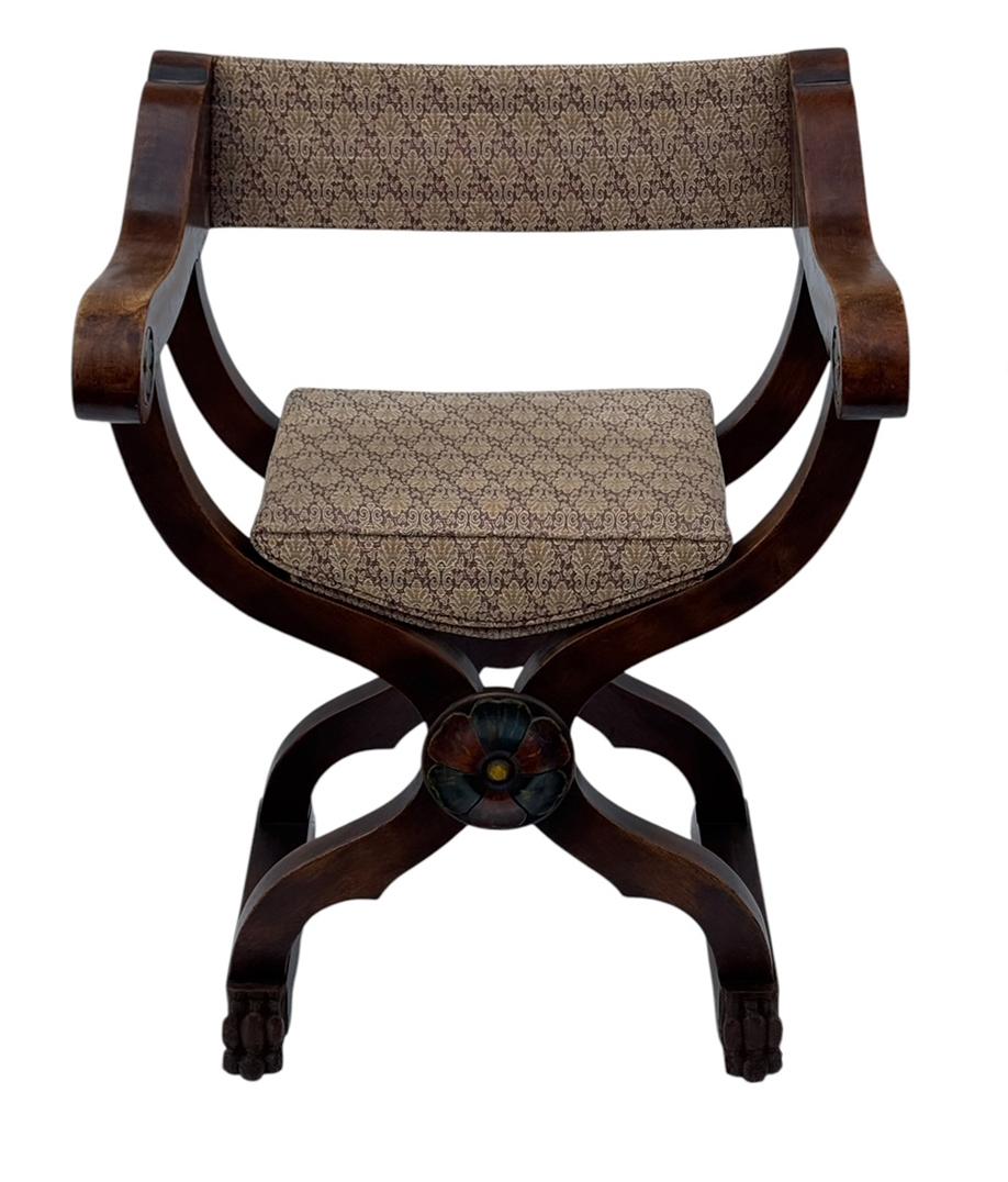 An incredible pair of Savonarola chairs from Italy circa 1890's. They feature heavy solid wood construction with great hand painted detailing. Upholstery was redone some years back, but can easily be recovered again. Wood is original and shows warm
