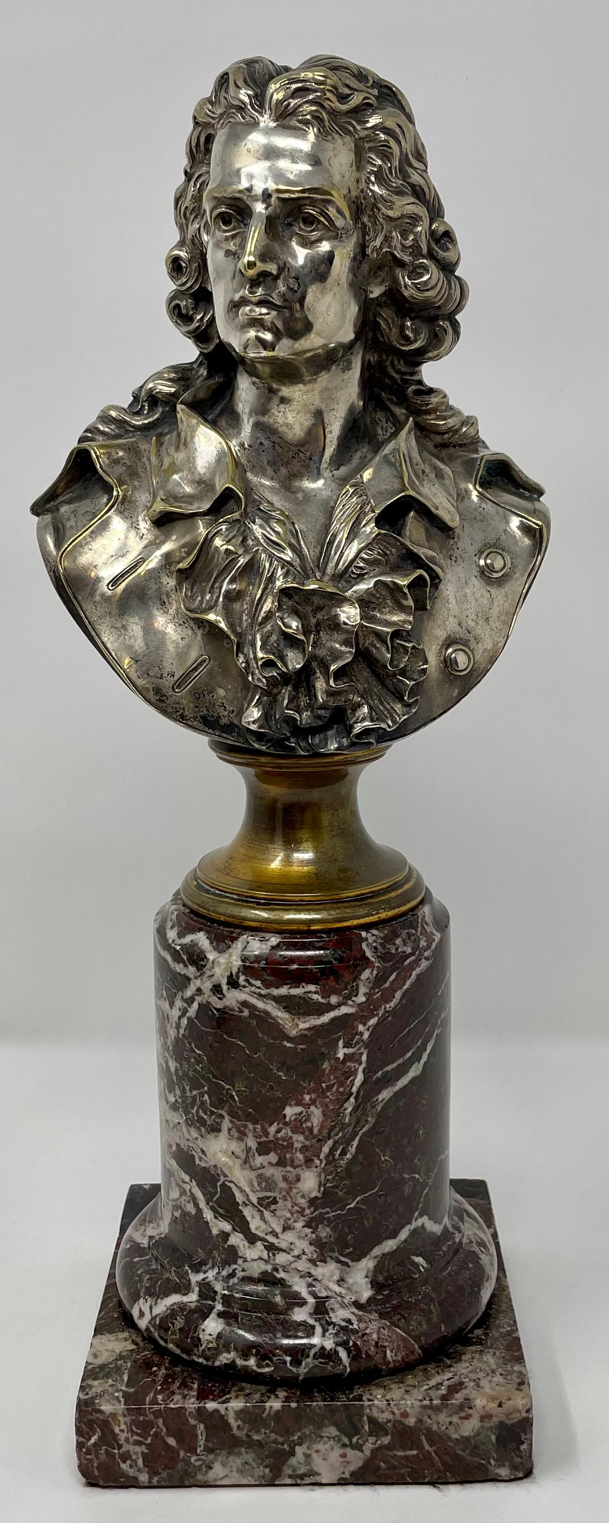 Pair of 19th century antique silver on bronze busts on marble bases.