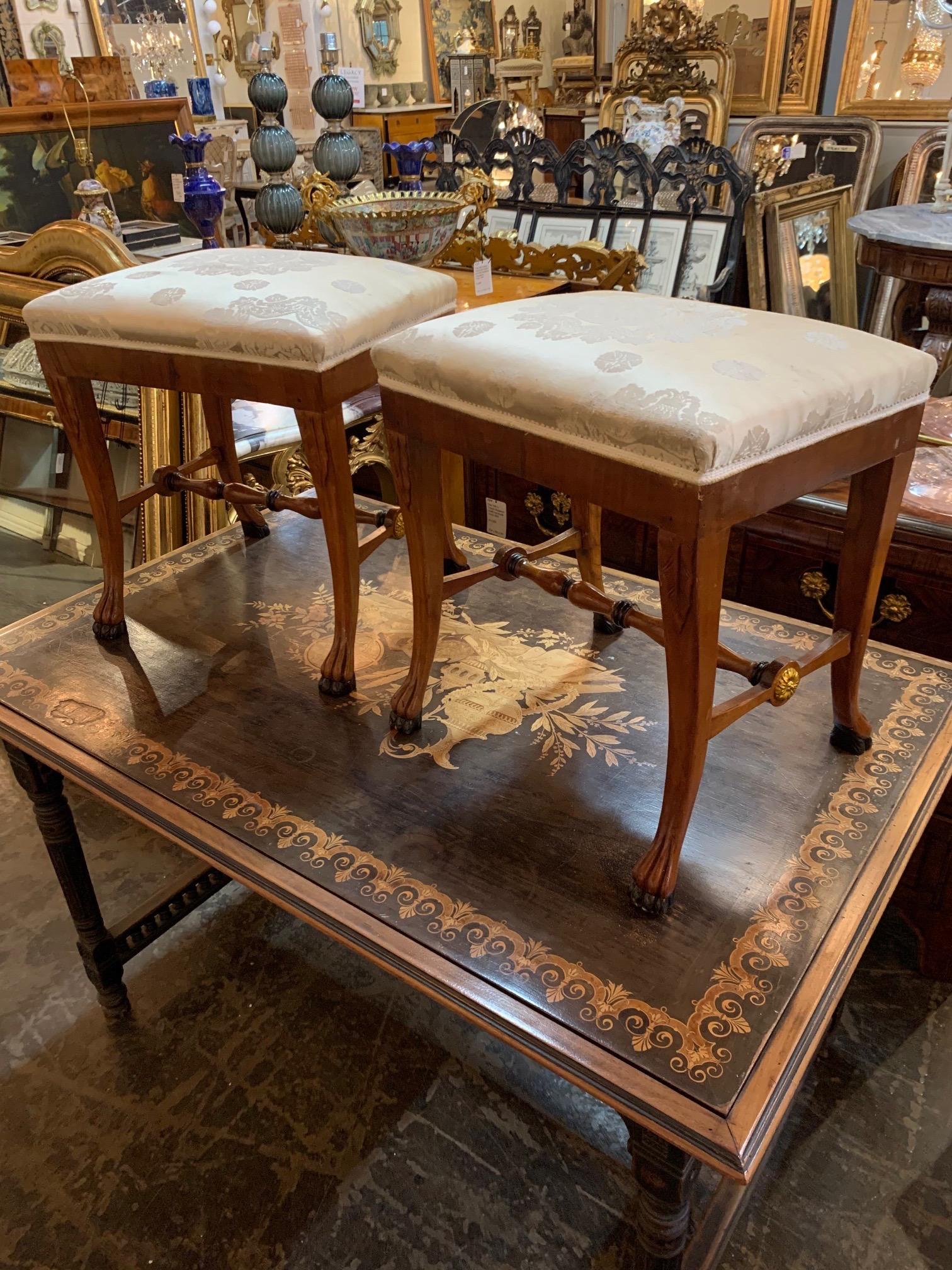Handsome pair of 19th century Austrian Biedermeier fruitwood stools. These have gilt and ebony accents along with gorgeous silk upholstery. Super elegant!