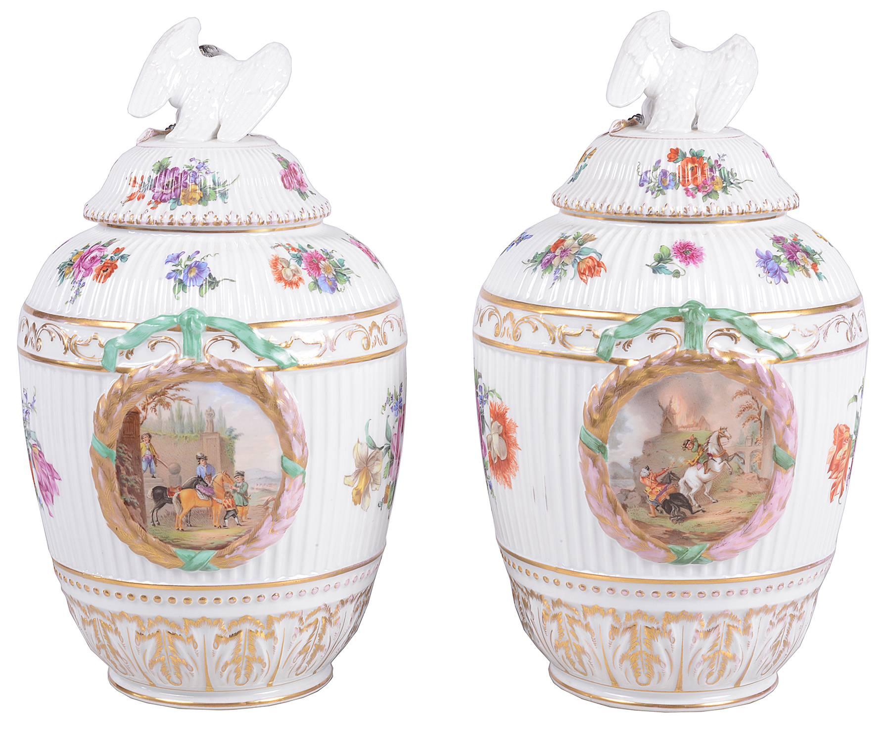 A good quality pair of 19th century Berlin porcelain lidded vases. Each with Swan finials to the lids, floral decoration and panels depicting horse man.