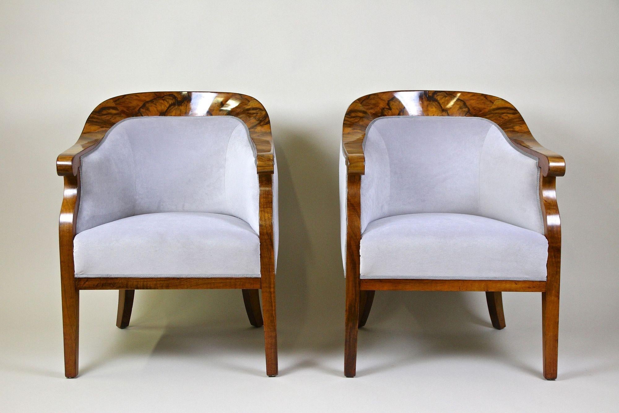 Absolute stunnning pair of 19th century nutwood Bergere chairs from the famous Biedermeier period in Vienna/ Austria around 1830. This remarkable set of rare Biedermeier armchairs has been elaborately restored in our restoration workshop. Impressing