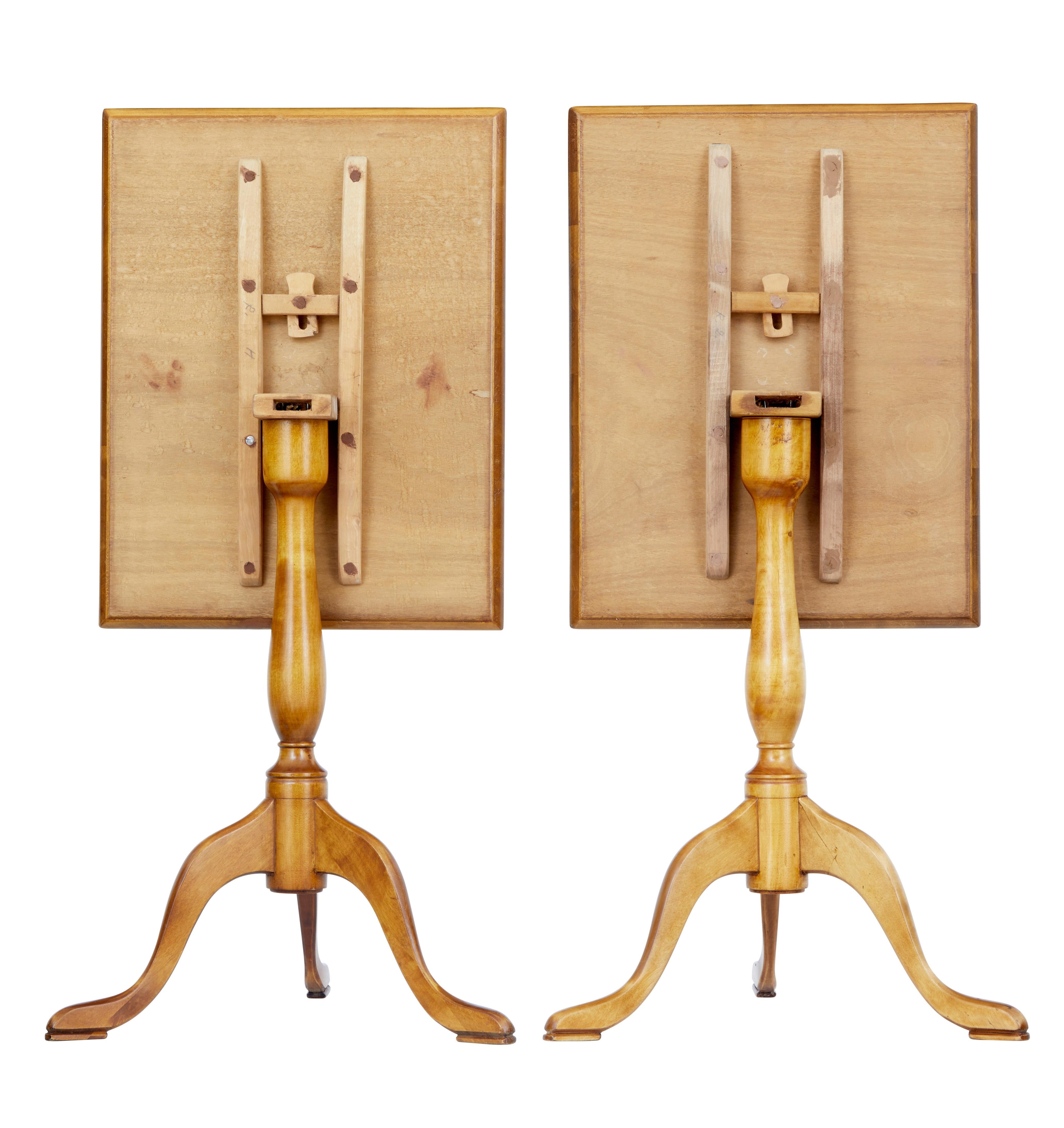 Pair of fine rectangular occasional tables, circa 1890.

Beautiful burr birch veneered tops with tilting mechanism for storage. Supported by turned stem and standing on tripod base, terminating on pad foot.

Rich golden color.