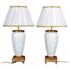 Pair of 19th century Biscuit and Gilded Bronze Table Lamps, Napoleon III Period.