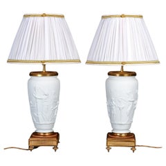Pair of 19th century Biscuit and Gilded Bronze Table Lamps, Napoleon III Period.