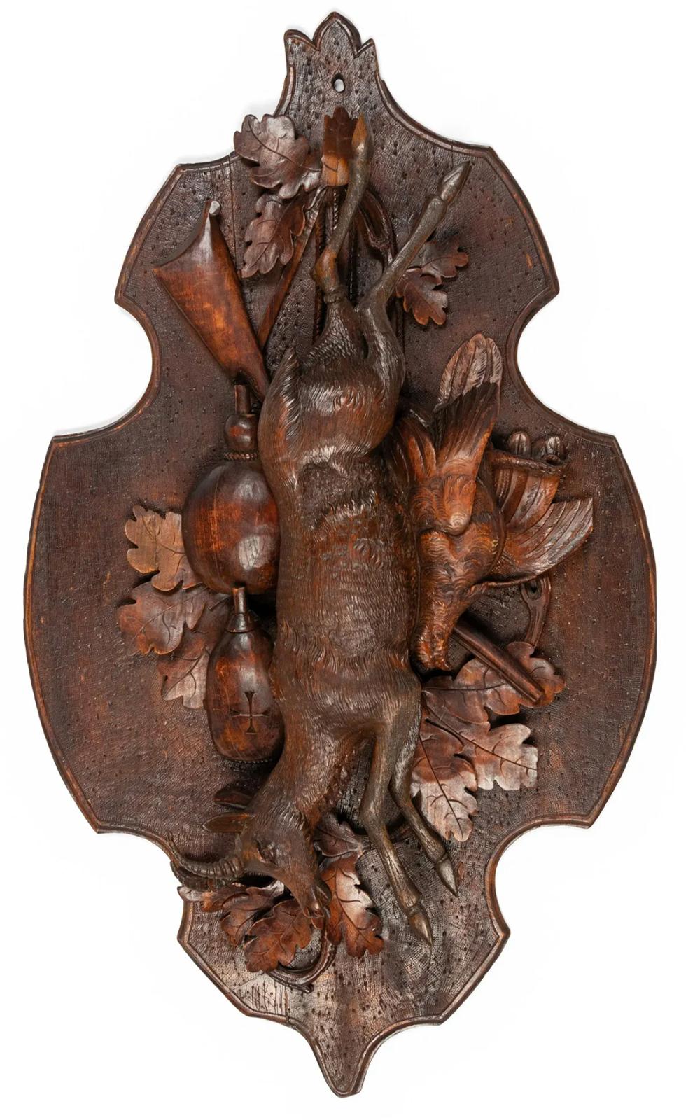 A large pair of carved walnut Black Forest game plaques from the late 19th century.

Dimensions: 3