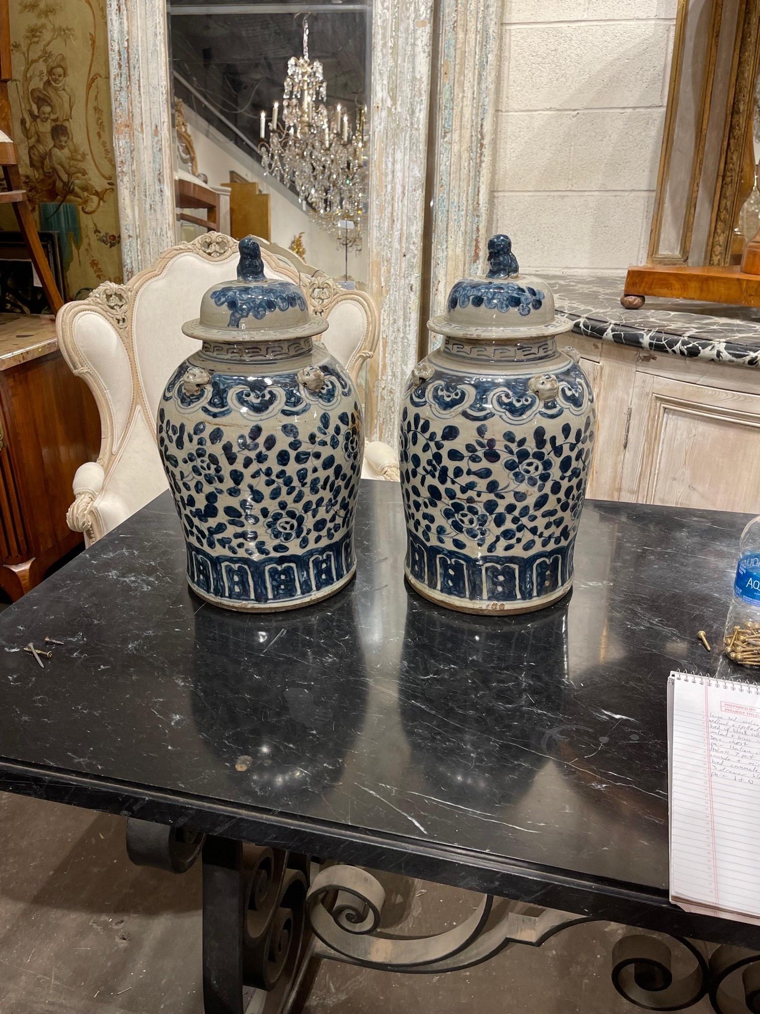 Very pretty pair of 19th century blue and white Chinese ginger jars. Featuring a lovely floral design. Note: There are a few small chips but overall condition is good.