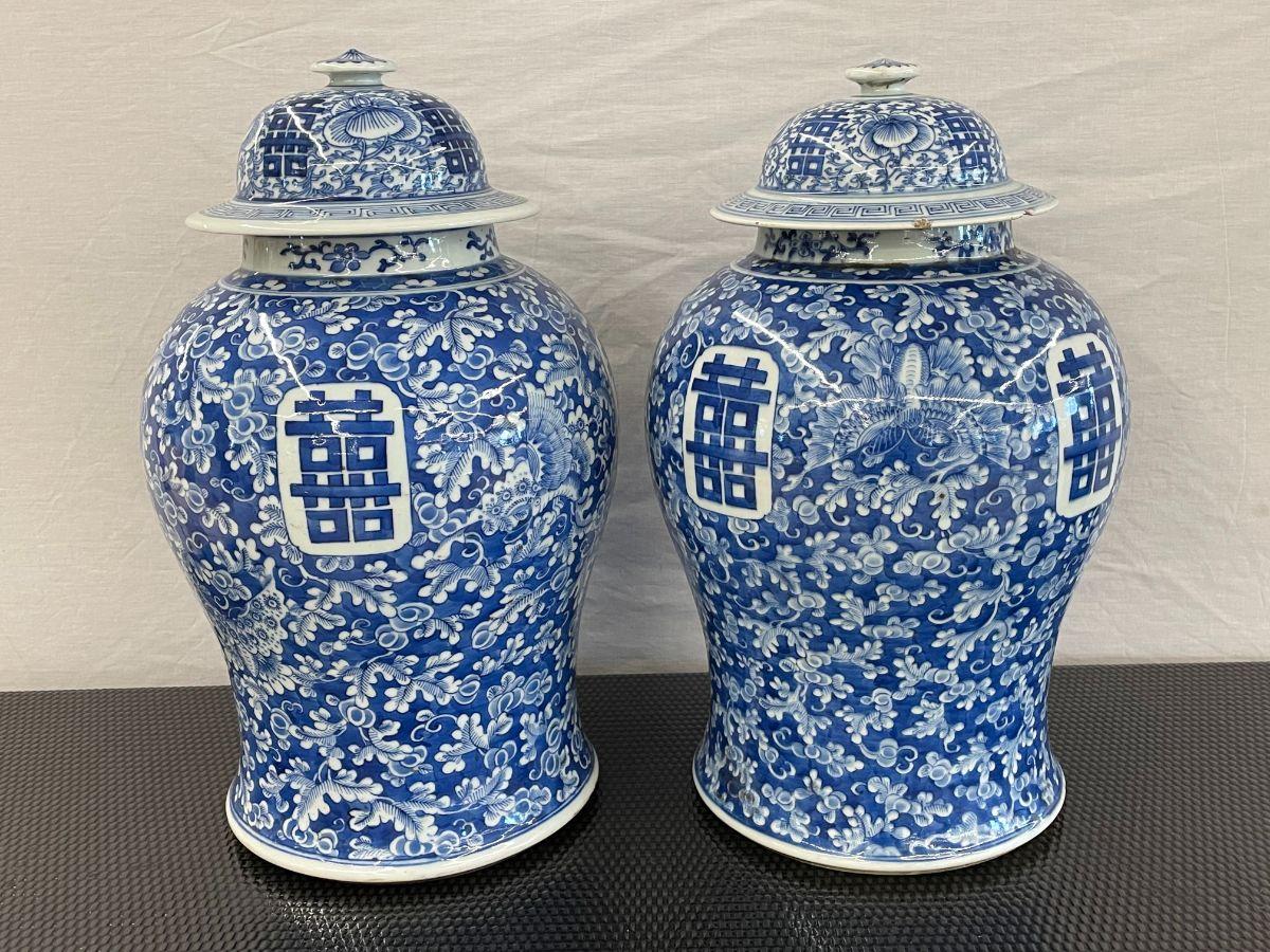 Pair of 19th century blue and white temple jars, Chinese or Urns. Each 19 inch large and impressive Urn with a full original lid, measures 15 in High without the lid. The pair signed on the bottoms. The pair in very good condition with some nicks