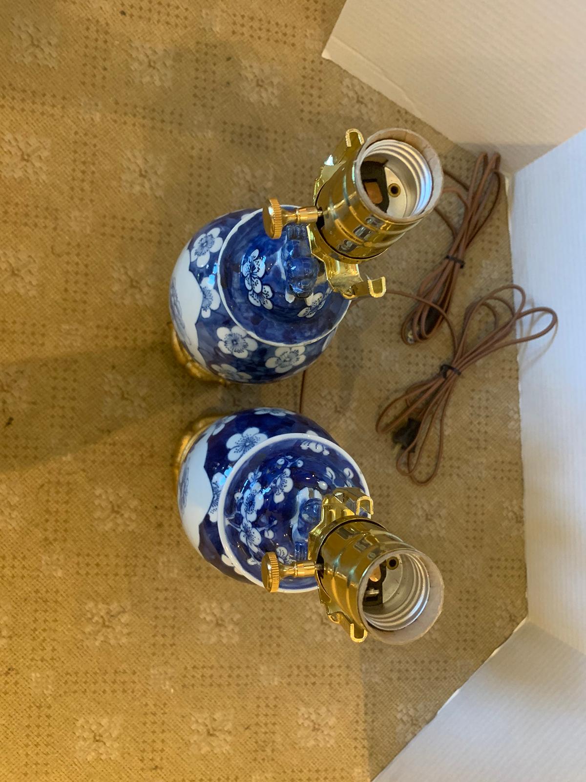 Pair of 19th century blue and white porcelain vases as lamps on custom giltwood bases
new wiring.