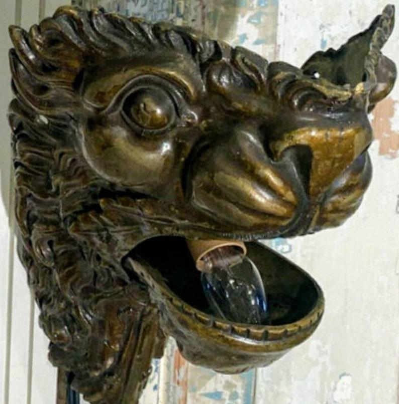 Pair of 19th Century Brass Lion Head Electrified Wall Sconces In Good Condition For Sale In Forney, TX