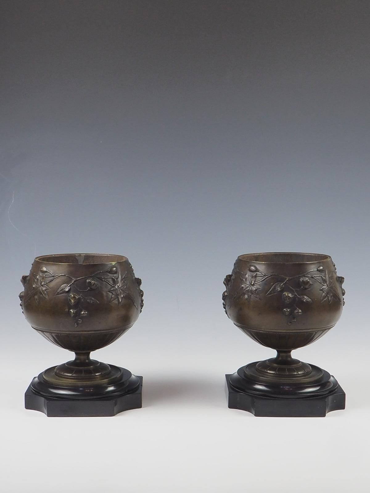 Pair of 19th Century Bronze and Marble Table Top Planters / Urns

Finely decorated with leaves and flowers on a stepped black marble base

Both planters have liners 

Measurement

Height:  18 cm   /  7.08  inches (each)

Width:  14 cm   /  5.51 