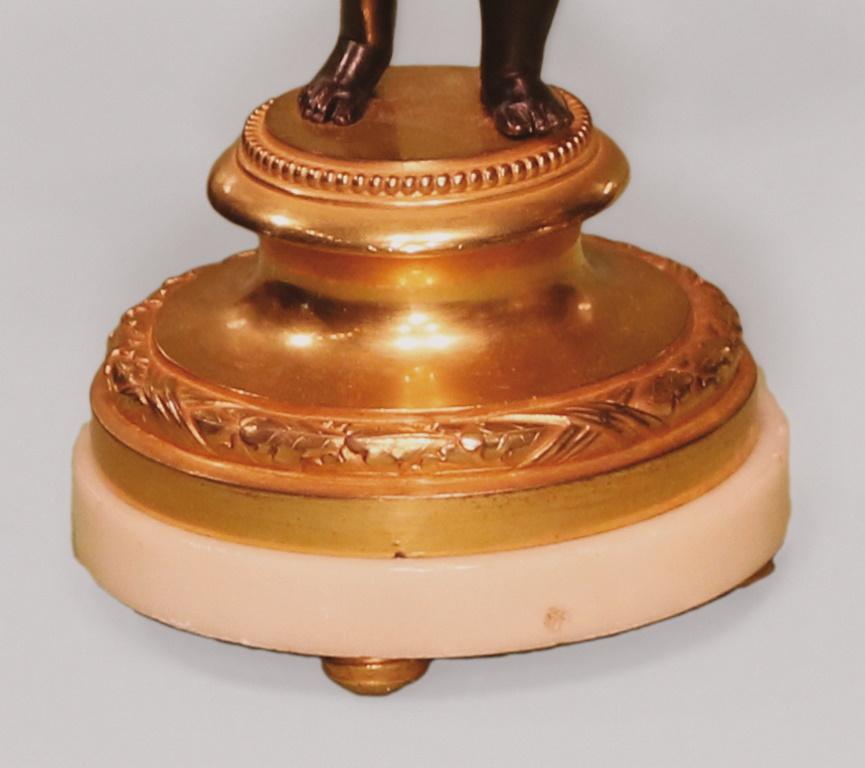 Patinated Pair of 19th Century Bronze and Ormolu Three-Light Cherub Candelabra For Sale