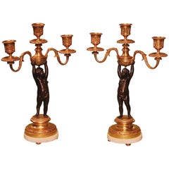 Pair of 19th Century Bronze and Ormolu Three-Light Cherub Candelabra