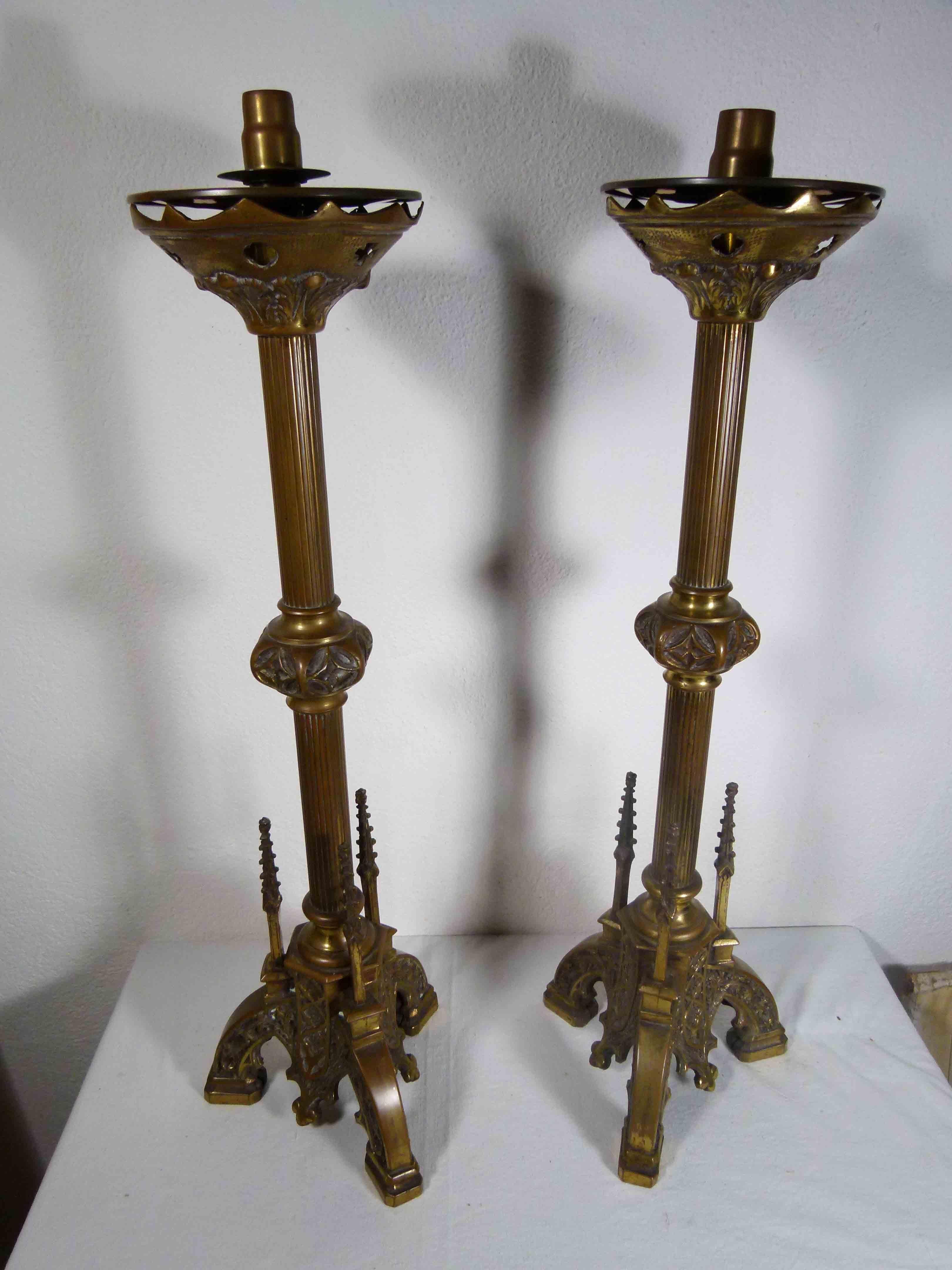 Pair of 19th century bronze candlesticks with hand carved ornaments.


 
