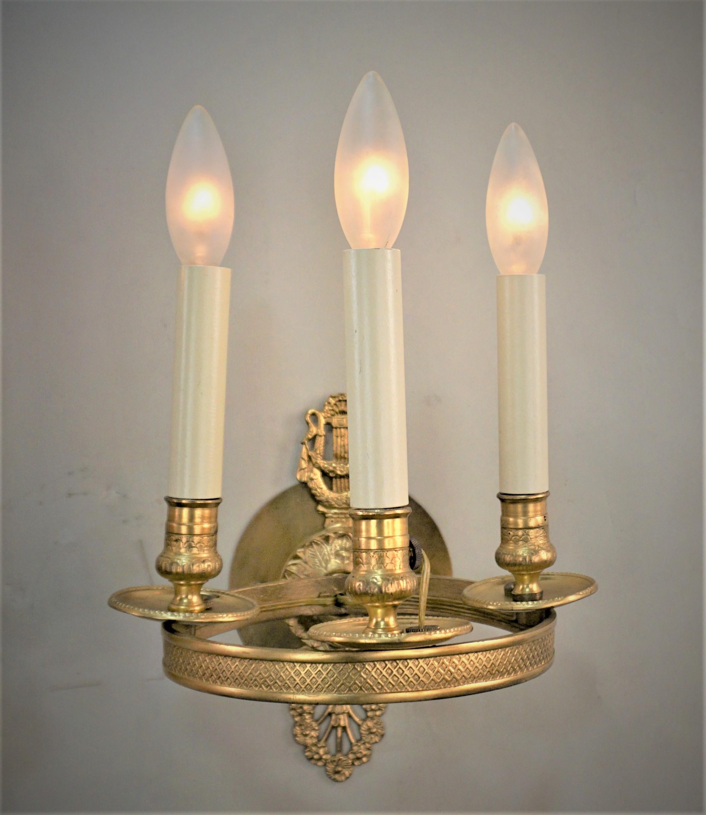 Pair 19th century three light of French bronze wall sconces.