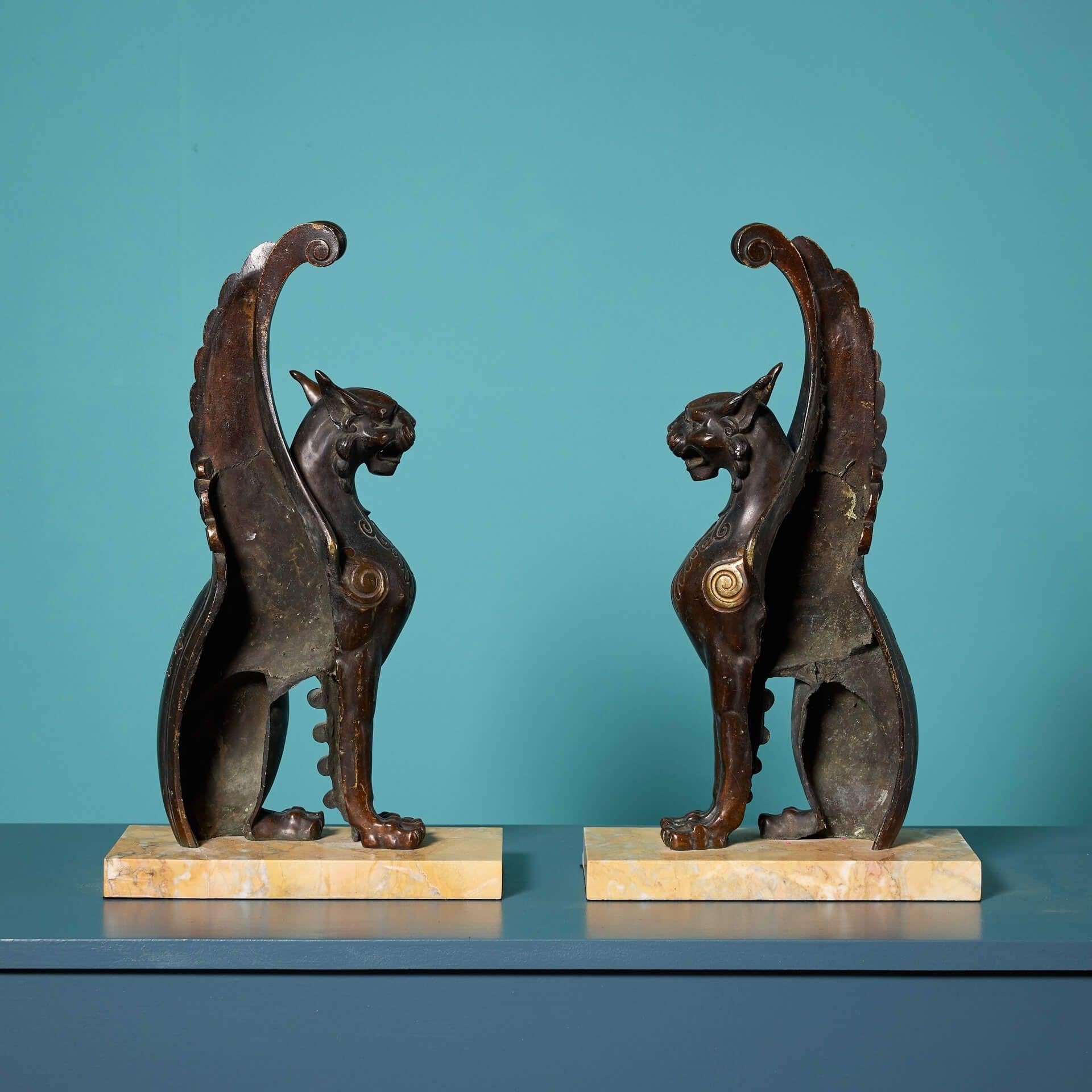 English Pair of 19th Century Bronze Winged Lion Sculptures on Marble Bases For Sale