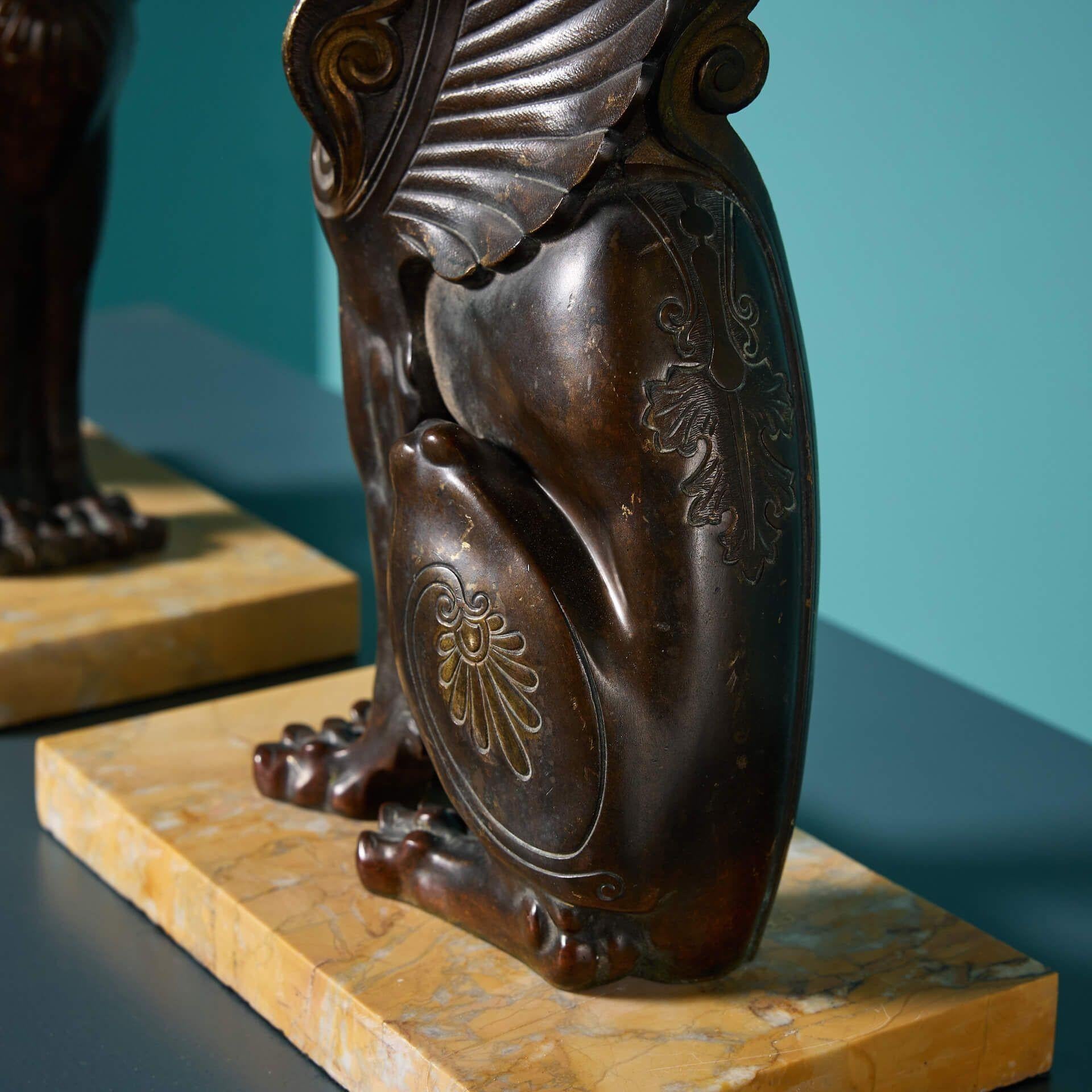 Pair of 19th Century Bronze Winged Lion Sculptures on Marble Bases In Fair Condition For Sale In Wormelow, Herefordshire
