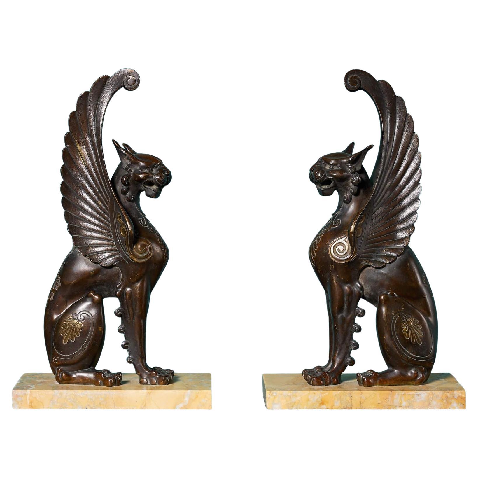 Pair of 19th Century Bronze Winged Lion Sculptures on Marble Bases For Sale
