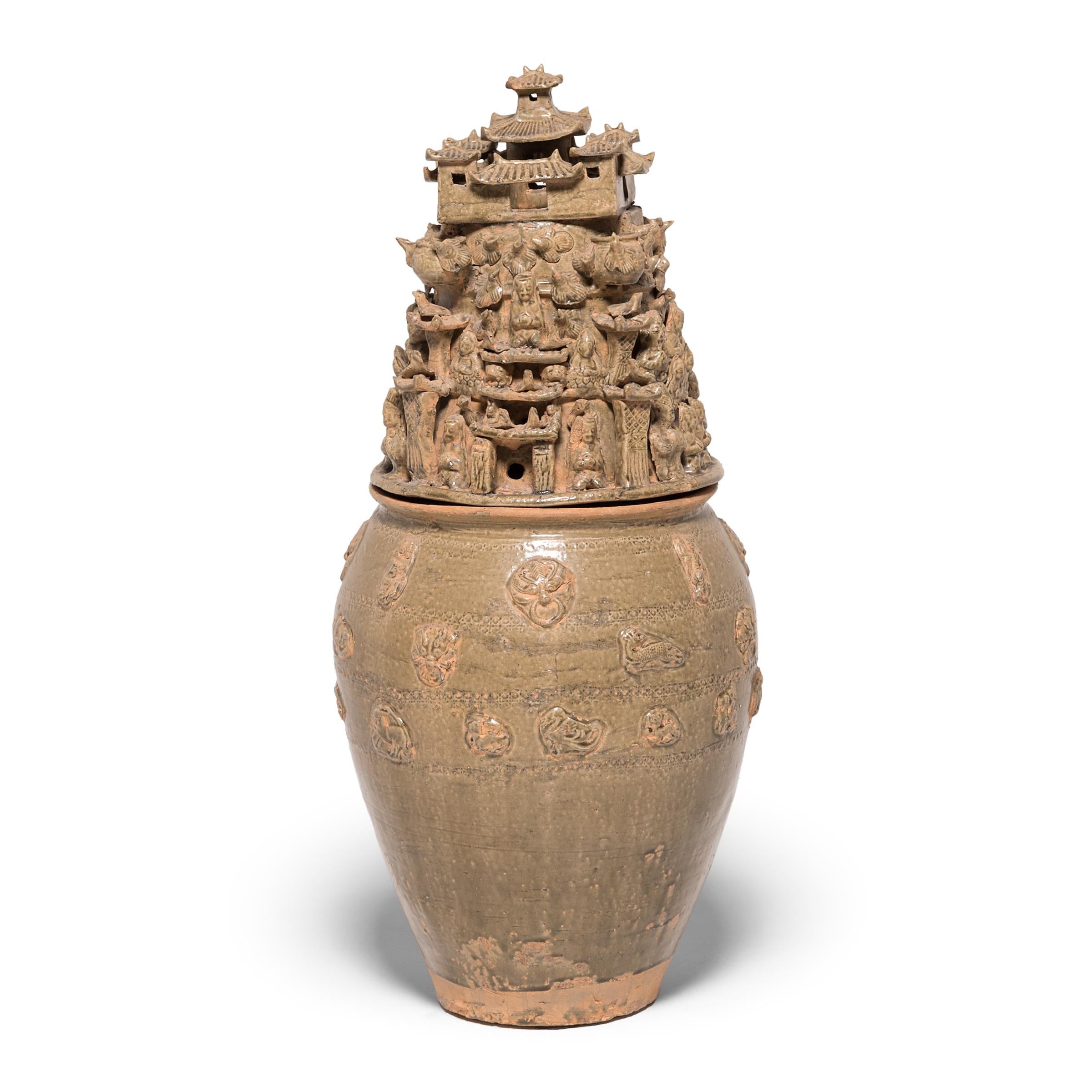 Handcrafted in China's Jiangxi province in the early 19th century, these tall ceramic vessels were shaped with exquisite detail in the spirit of ancient temple jars. The style and neutral glazing of these two urns are reminiscent of Han-dynasty