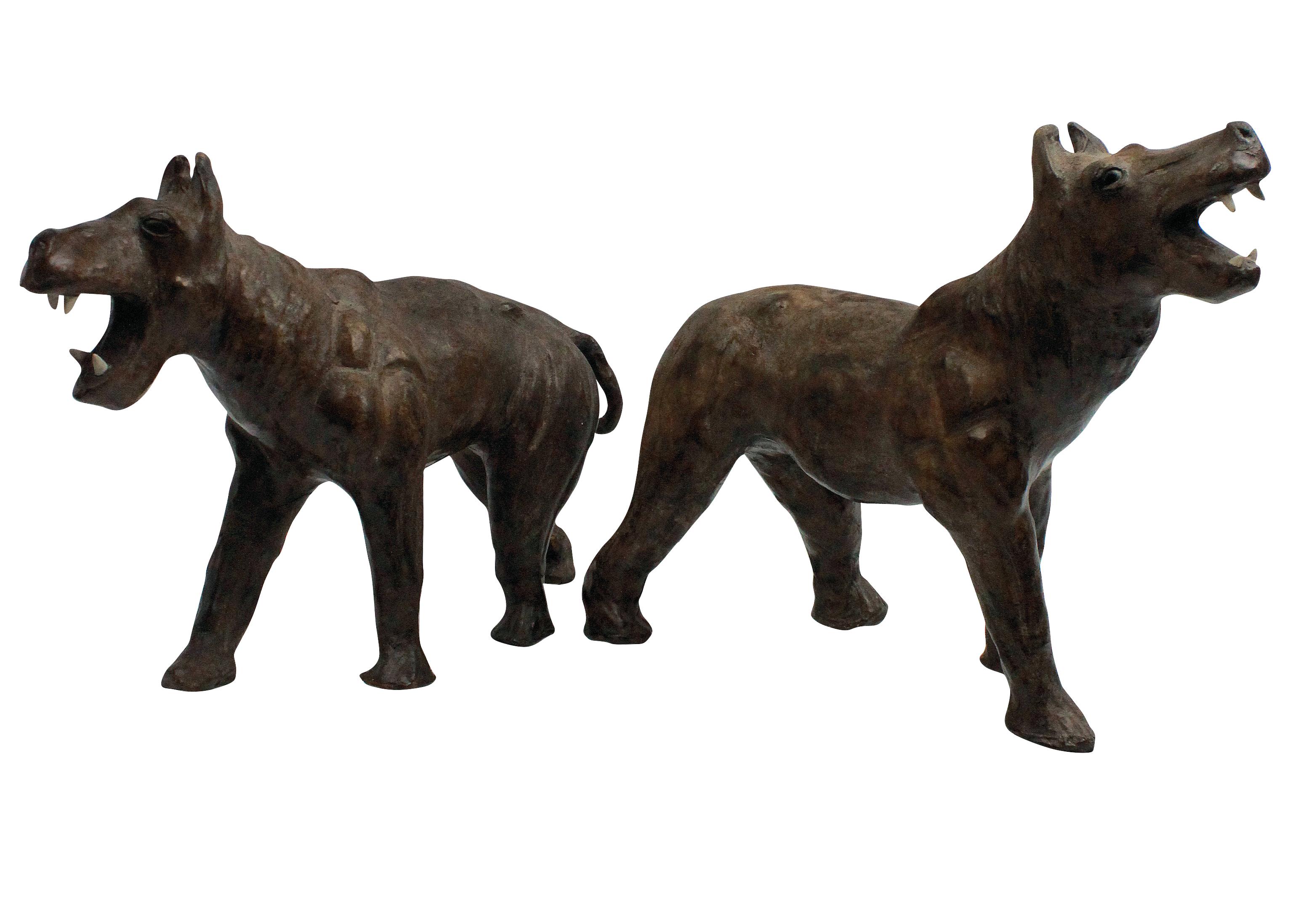 A pair of charming Burmese leather mache Burmese tigers, with glass eyes and bone teeth.