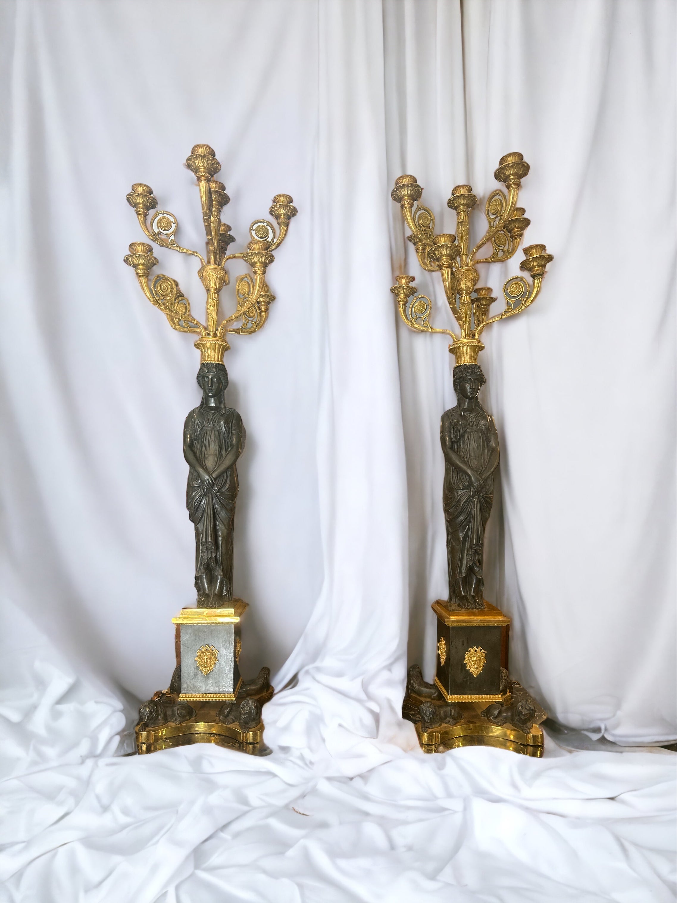 Rare pair of large Empire candlesticks of excellent workmanship in gilded and patinated bronze from the so-called 