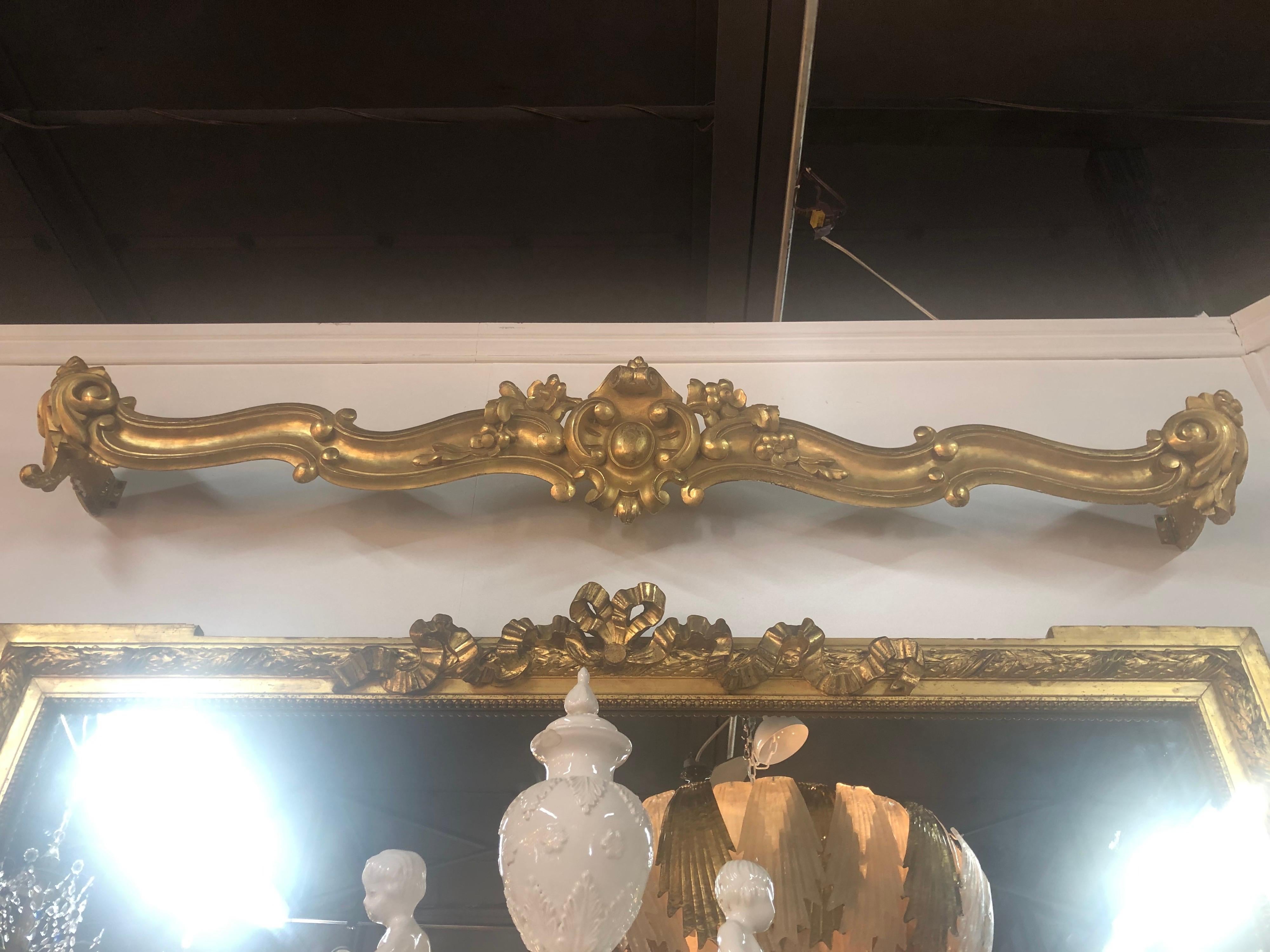 Decorative pair of 19th century carved and giltwood window valances. Make a stylish statement!