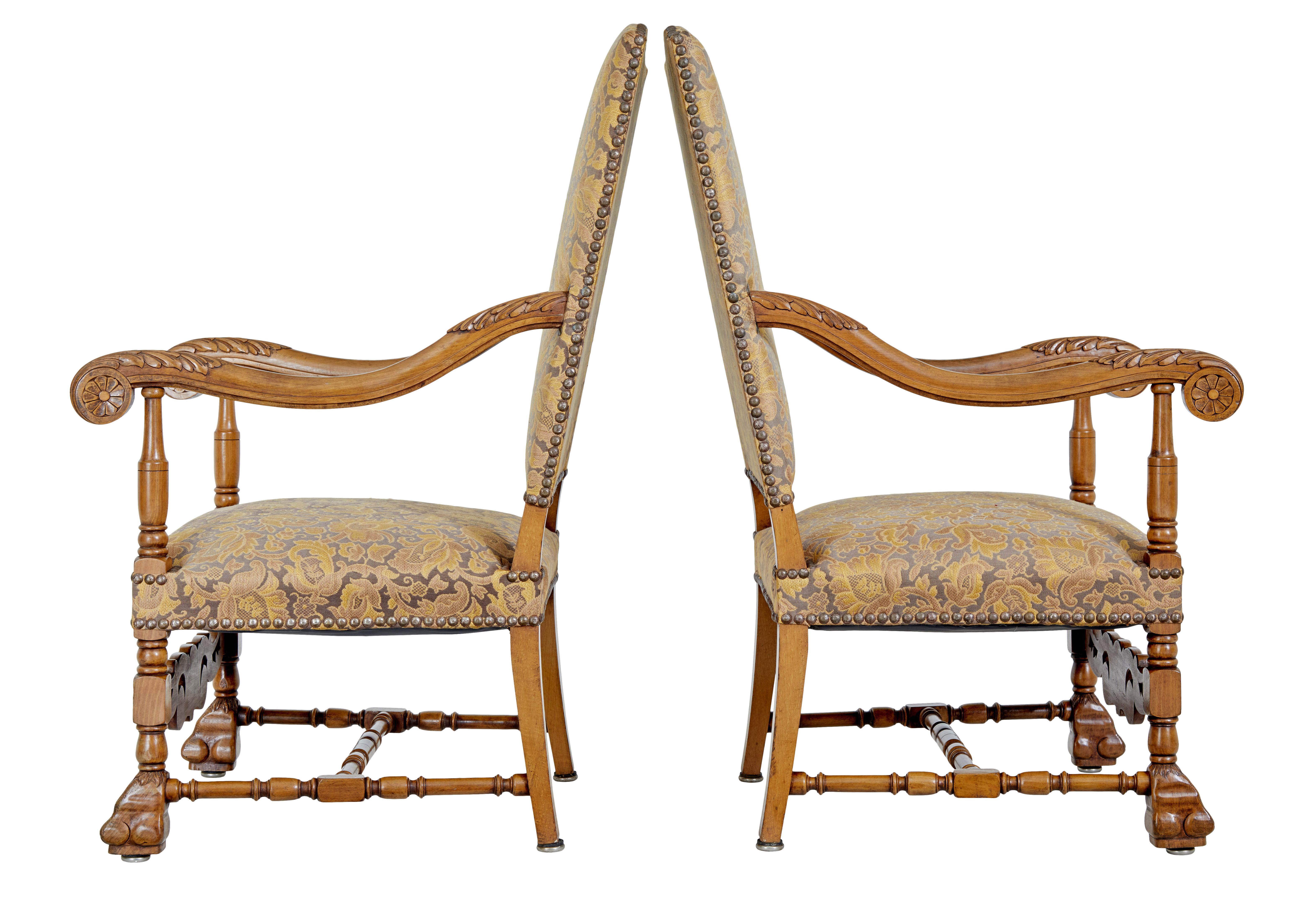 Pair of 19th century carved French baroque throne armchairs, circa 1890.

Good quality pair of armchairs of large proportions. Shield shaped backs, heavily carved scrolled arms with turned supports. Standing on turned front legs with paw feet,
