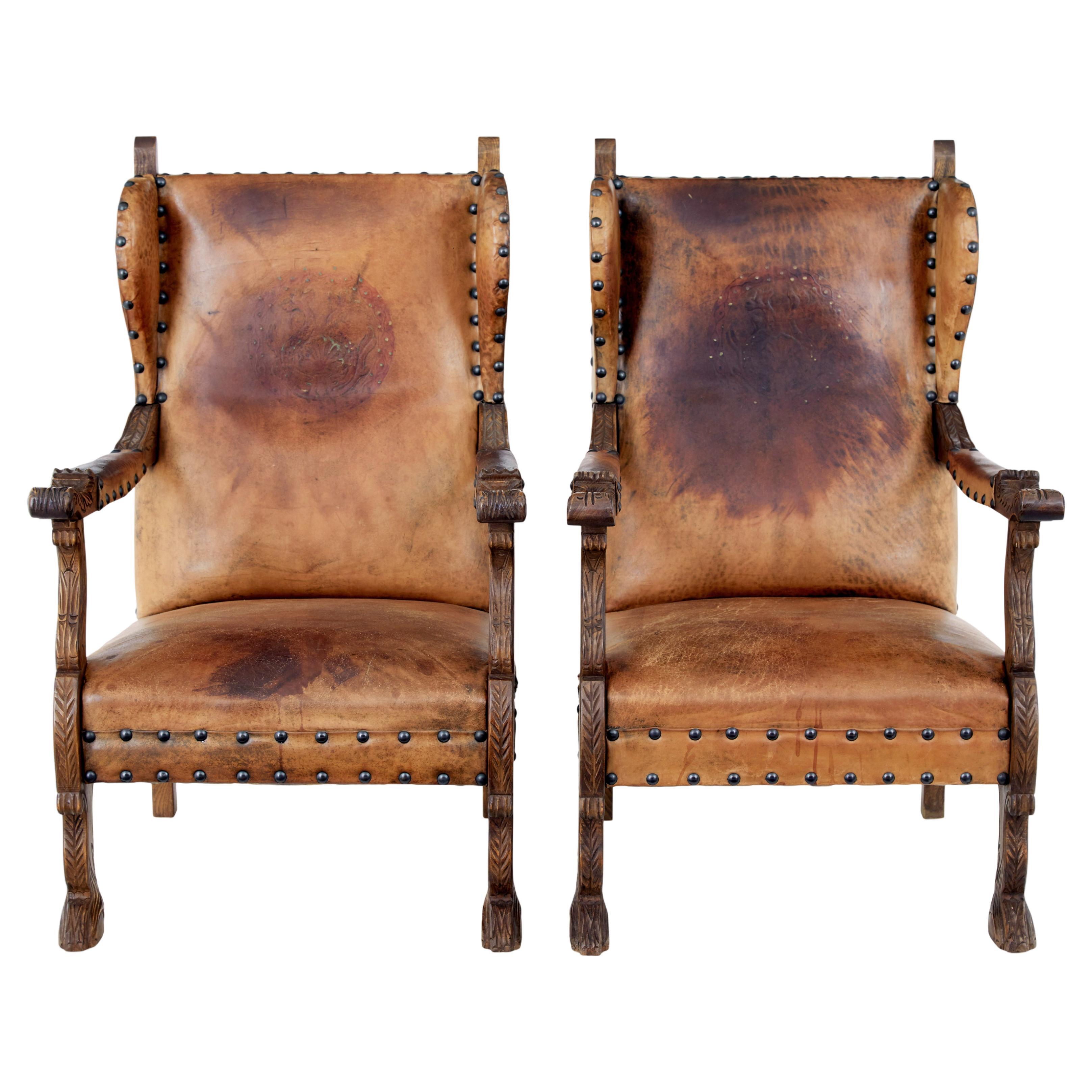 Pair of 19th century carved oak and leather armchairs For Sale
