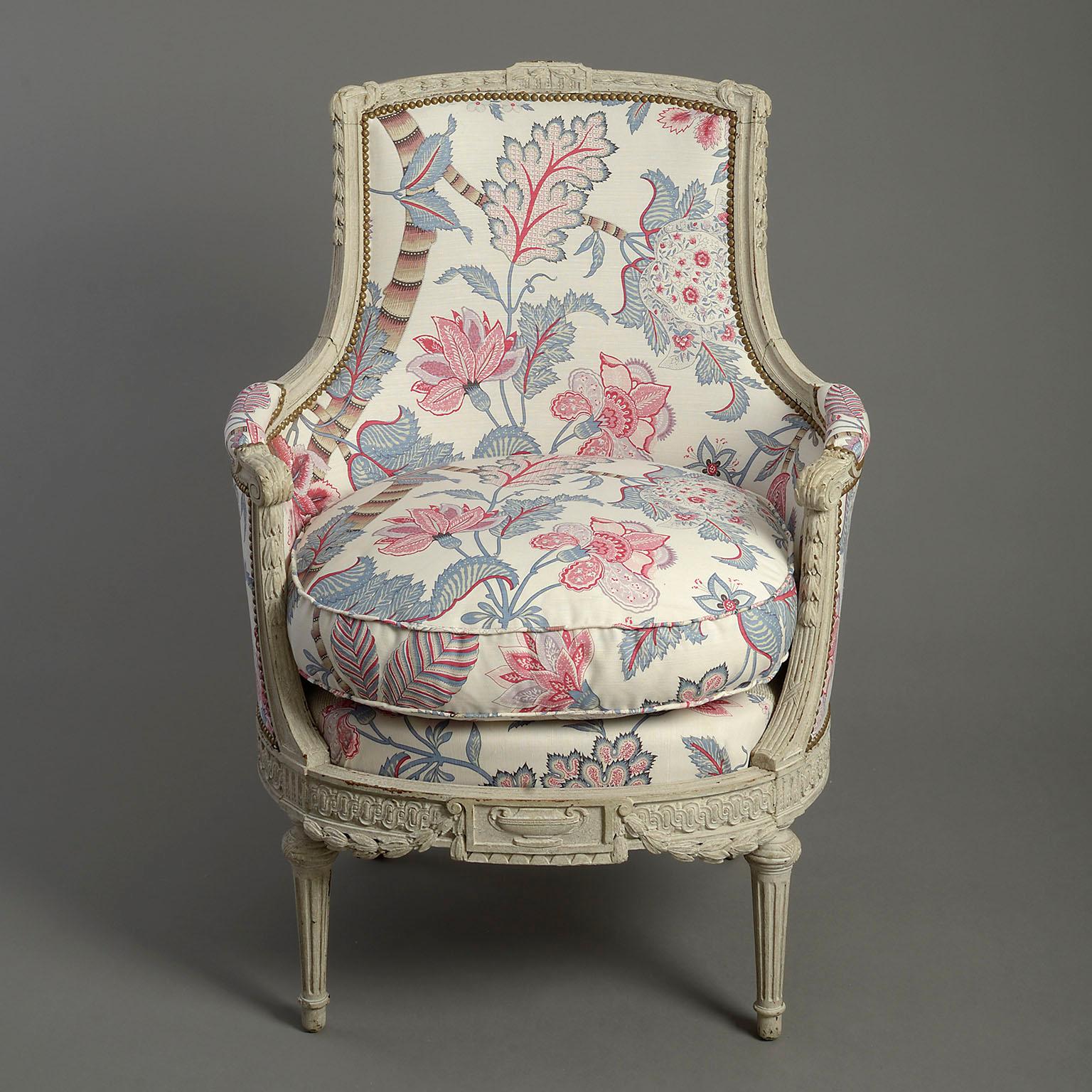 Pair of late nineteenth century richly carved and painted bergere armchairs in the Louis XVI manner. Upholsterd in Banyan Tree oyster linen by Bennison

From a private collection, Paris, France.