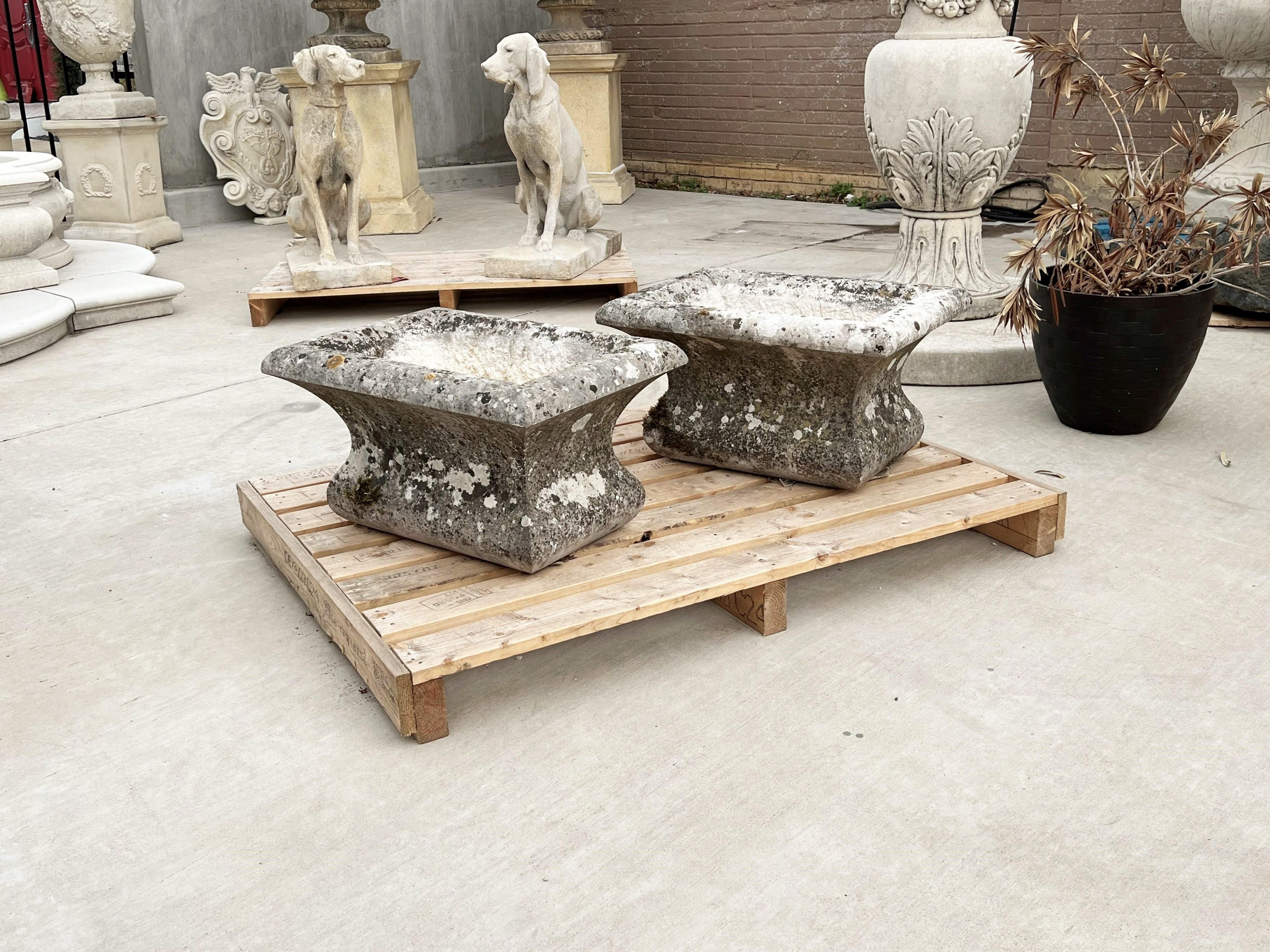 This pair of stone jardiniere planters from Dijon, France, have beautifully thick quarter round edges above the cavetto sides. Because the stones were hand-carved (in the 1800’s), the dimensions of each planter differ somewhat. The overall size of