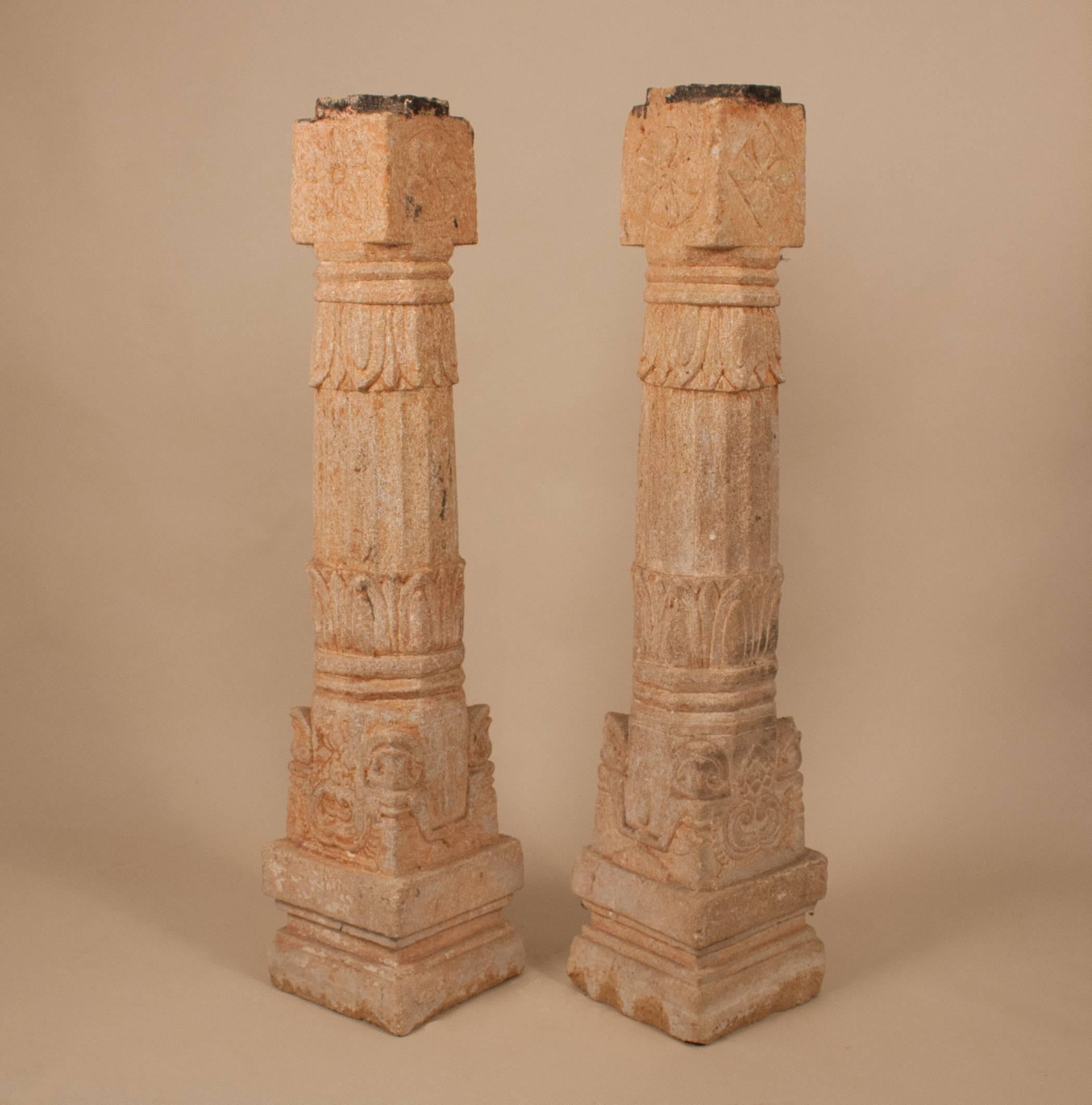 A pair of granite pillars with different carved lotus flower motifs, circa 1850. Standing just 40.25