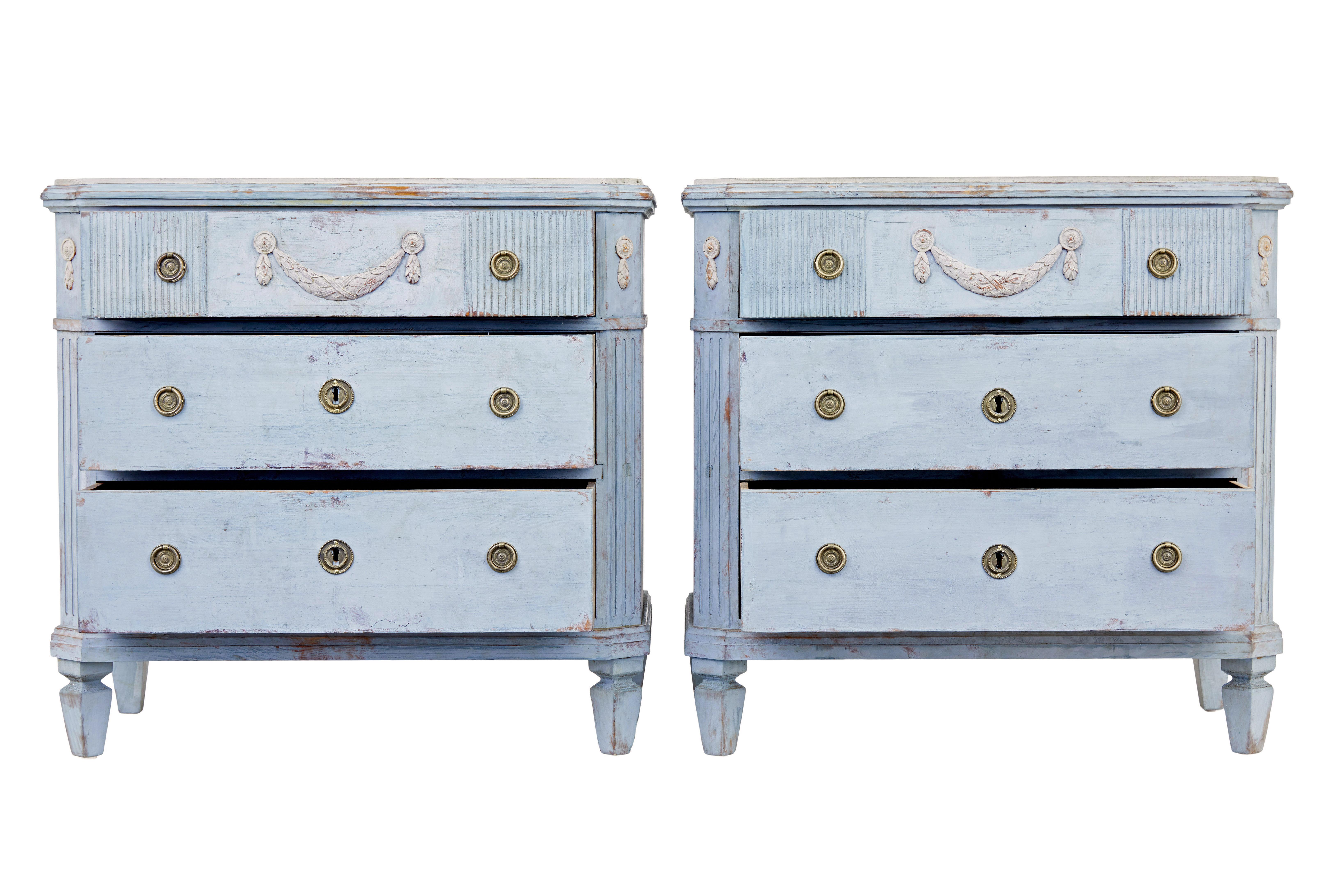 Pair of 19th century carved Swedish painted chest of drawers circa 1880.

Beautiful pair of Swedish 3 drawer commodes, very much in the Gustavian taste.

Presented in a light warm blue, with contrasting grey top surfaces.  Plain grey top surface