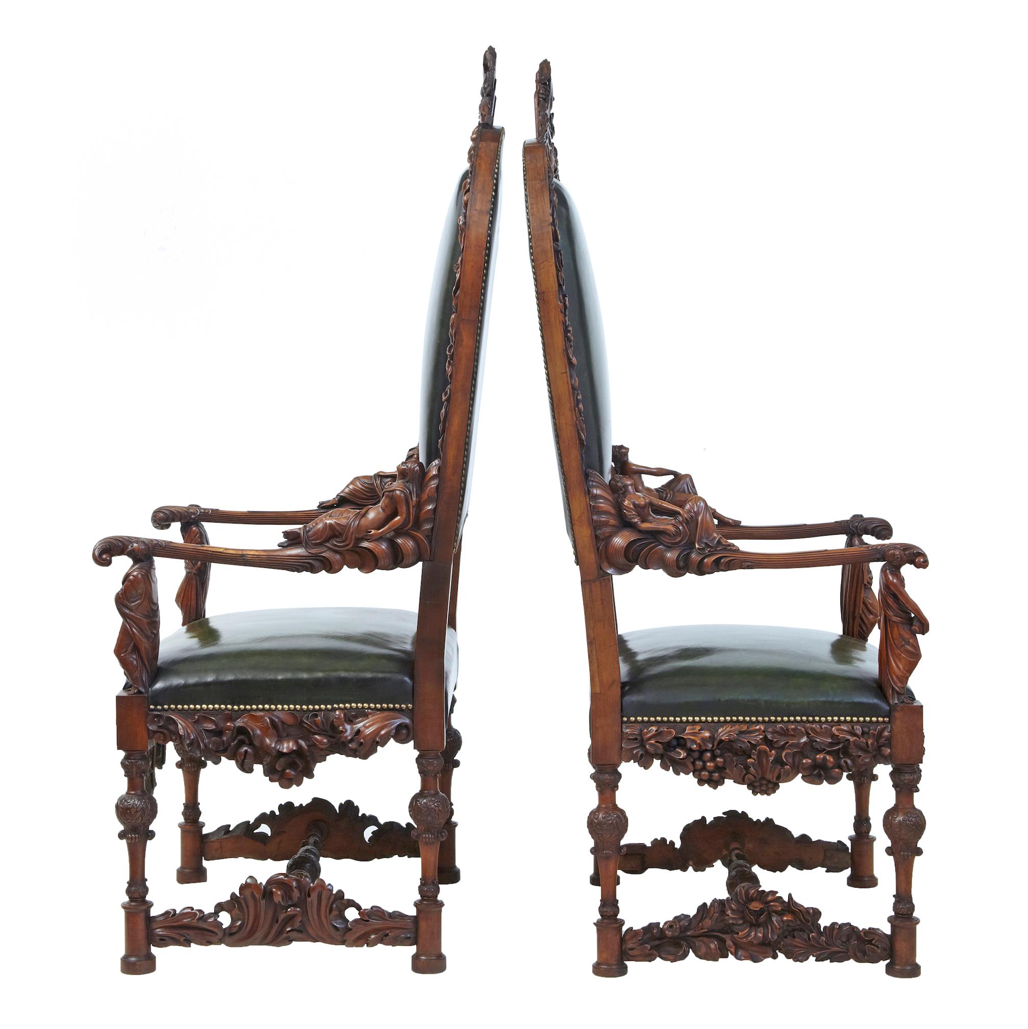 Pair of 19th century carved walnut Florentine Renaissance armchairs, circa 1860.
Profusely carved walnut carved in the Renaissance Revival style. Depicting eight classical carved figures, four of which are reclining nudes.
Fluted shaped arms are