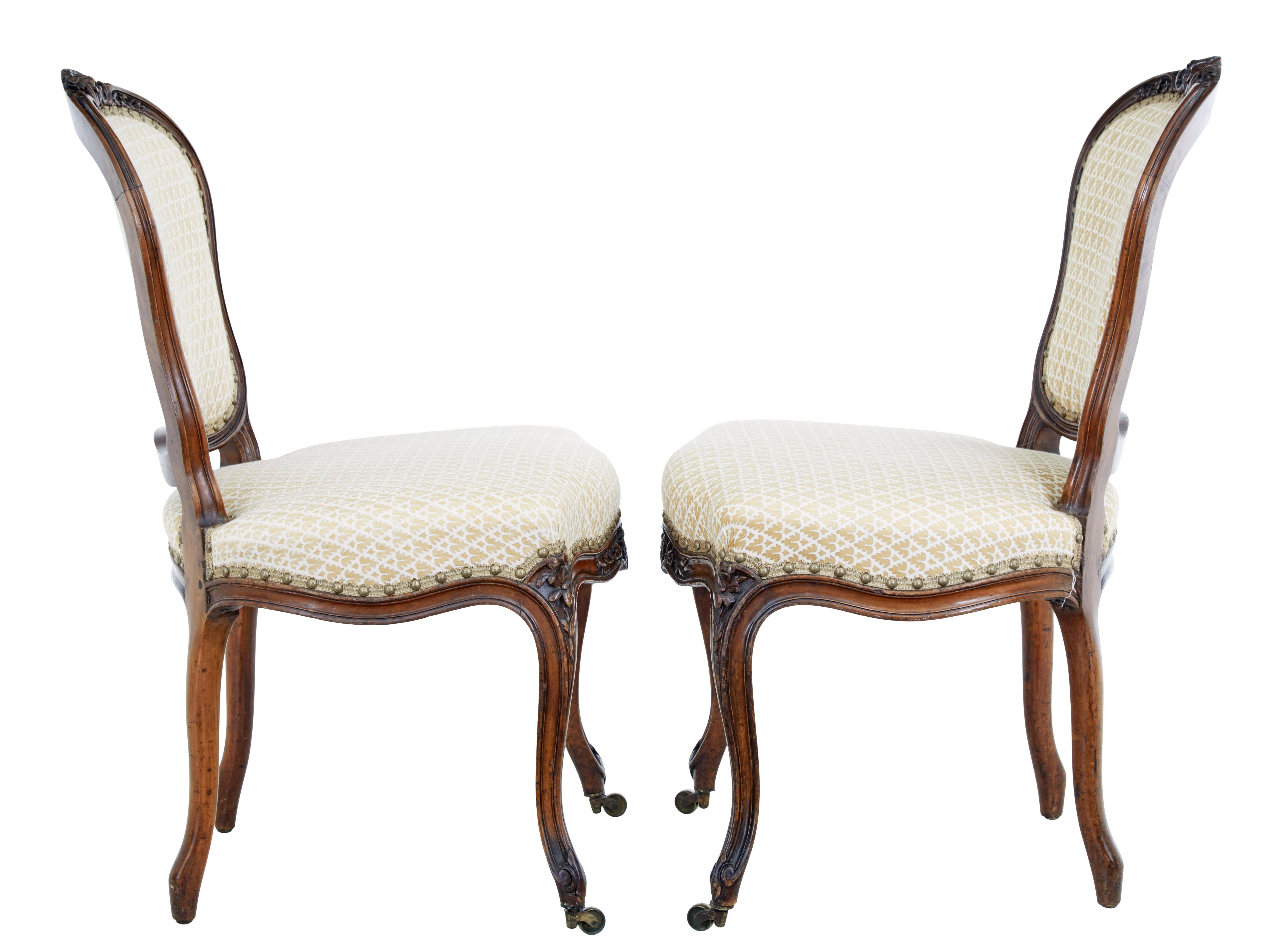 Fabric Pair of 19th Century carved walnut side chairs For Sale