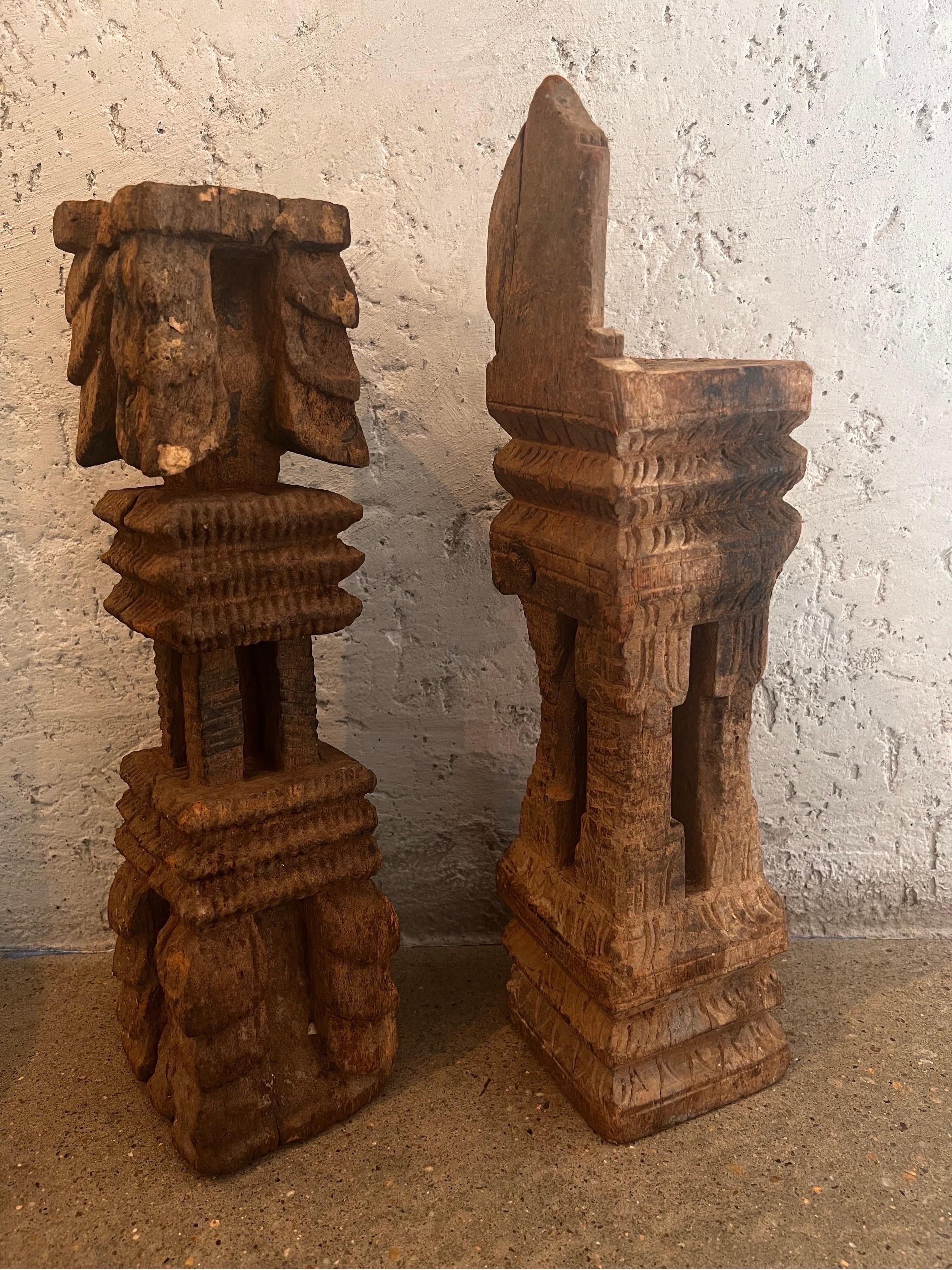 The beautifully carved wooden artifacts make for wonderful modern day candlesticks. Each uniquely carved with motifs of their origin.