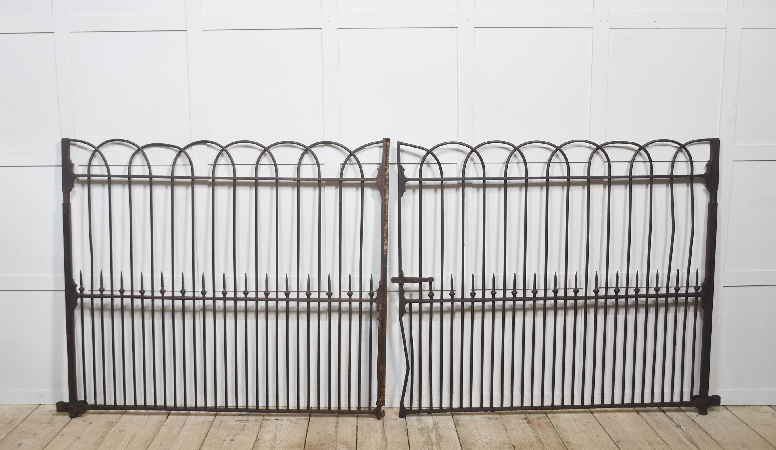 Pair of 19th-century five-foot cast and wrought iron driveway gates, having original latch and vertical rails.

Dimensions
Height 52.5 Inches
Width 122 Inches
Depth 4.5 Inches