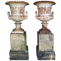 Pair of 19th Century Cast Iron Urns on Terracotta Stands