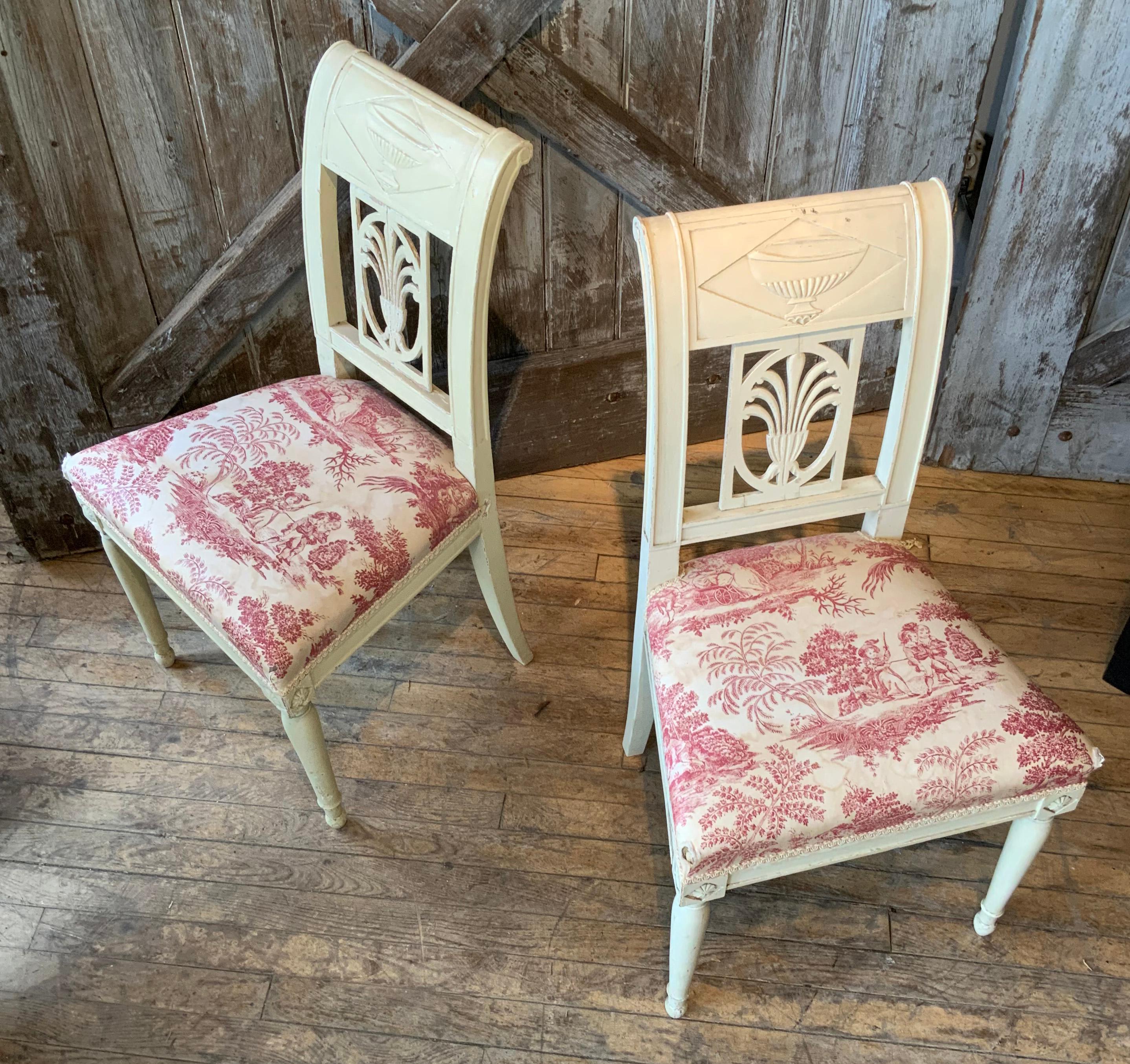 A very nice pair of side chairs from the Harold Brown Villa in Newport RI designed by Ogden Codman. beautifully carved with curved backs and detailed legs. with antique toile upholstery.